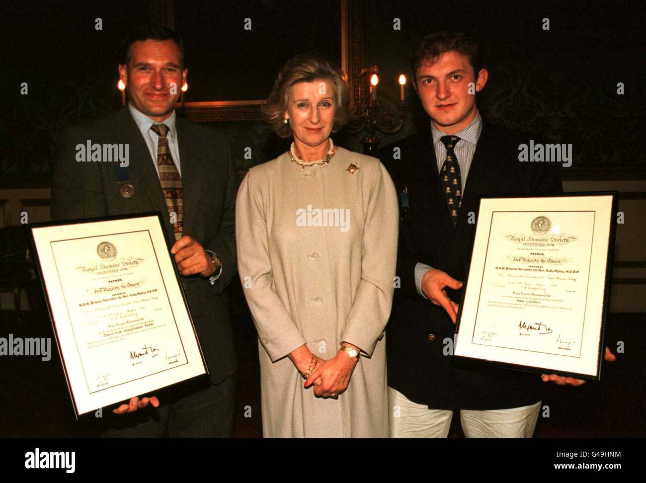 David Hempleman-Adams (R-L) Princess Alexandra of Kent and Rune Gjeldne after the pair were awarded the Royal Humane Society bronze award for bravery at St James' Palace. Stock Photo