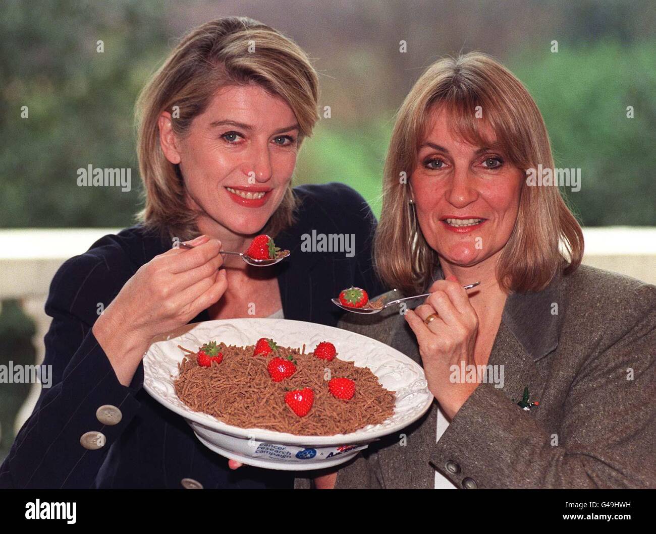 TV Personality Selina Scott (left) and former cancer patient Lynn Faulds-Wood with a bowl of Kellogs All Bran at a news conference where Kellogs and Cancer Research Campaign join forces to highlight Britain's second biggest killer bowel cancer, today (Tuesday). Photo by Fiona Hanson /PA. Stock Photo