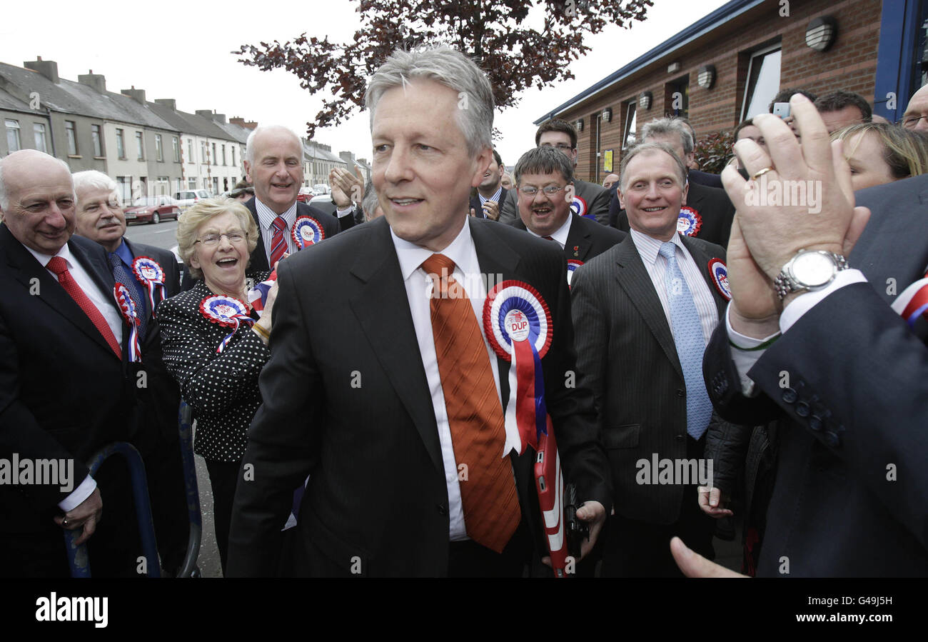 Northern Ireland first Minister Peter Robinson (left) arrives at Ards Leisure centre where the count for his East Belfast Assembly seat is taking place. Stock Photo