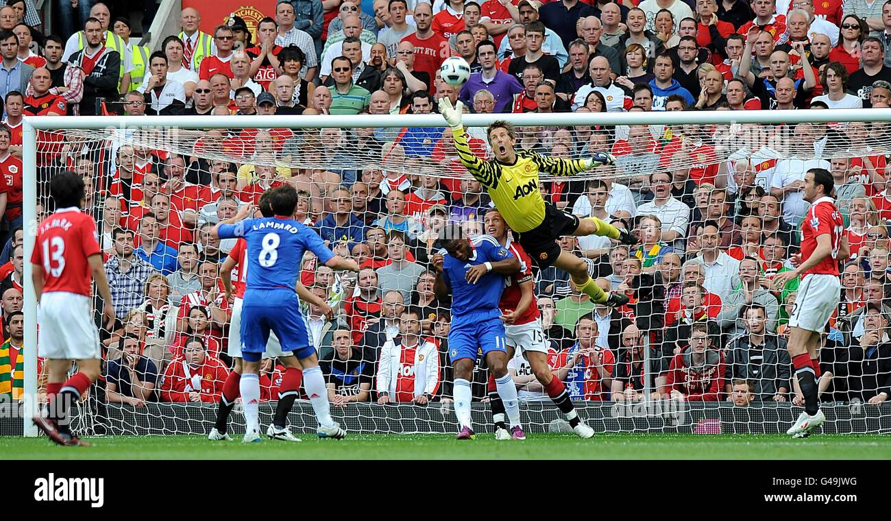 Manchester United goalkeeper Edwin Van der Sar punches the ball clear