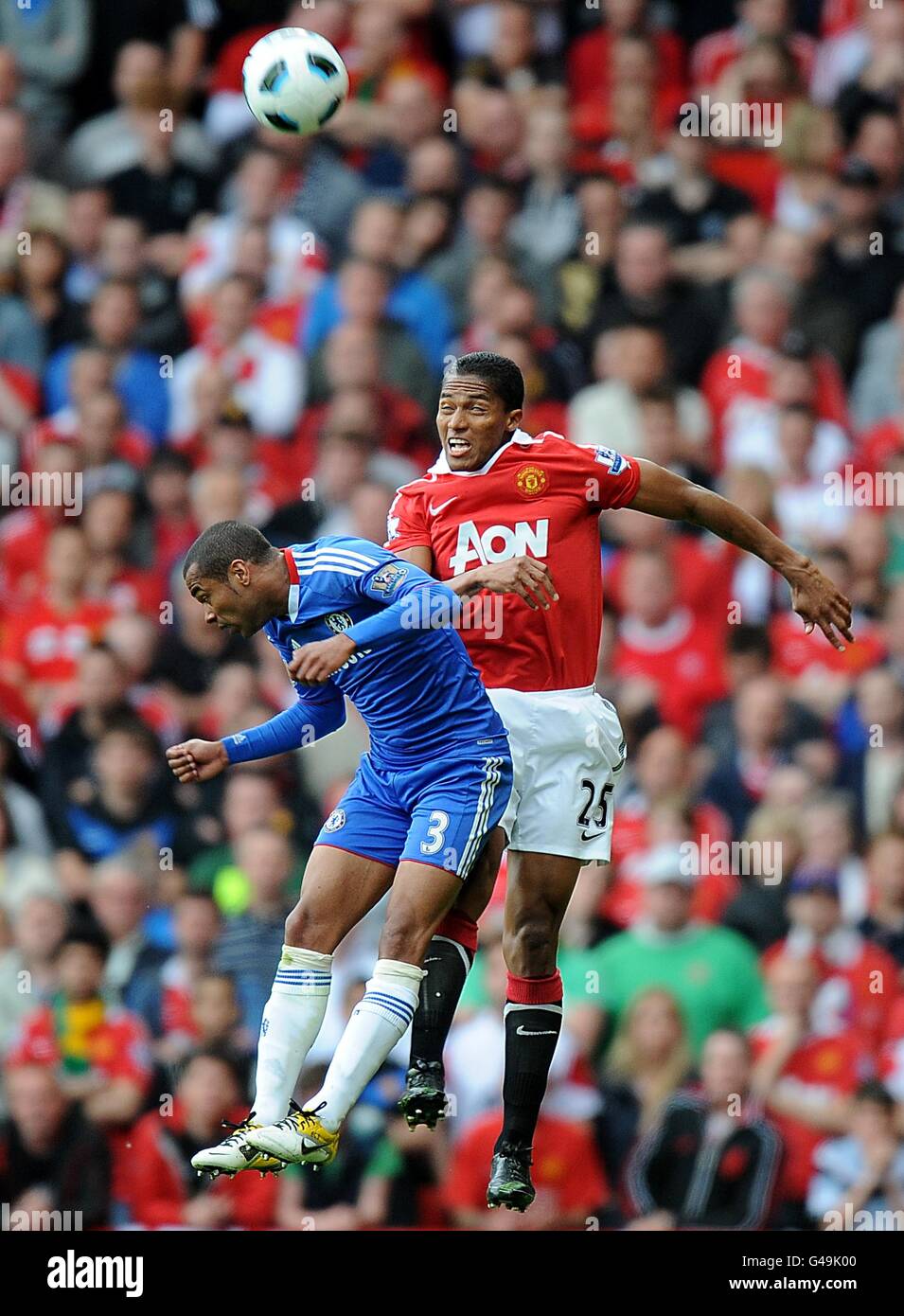 Manchester United's Antonio Valencia (right) and Chelsea's Ashley Cole (left) battle for the ball in the air Stock Photo
