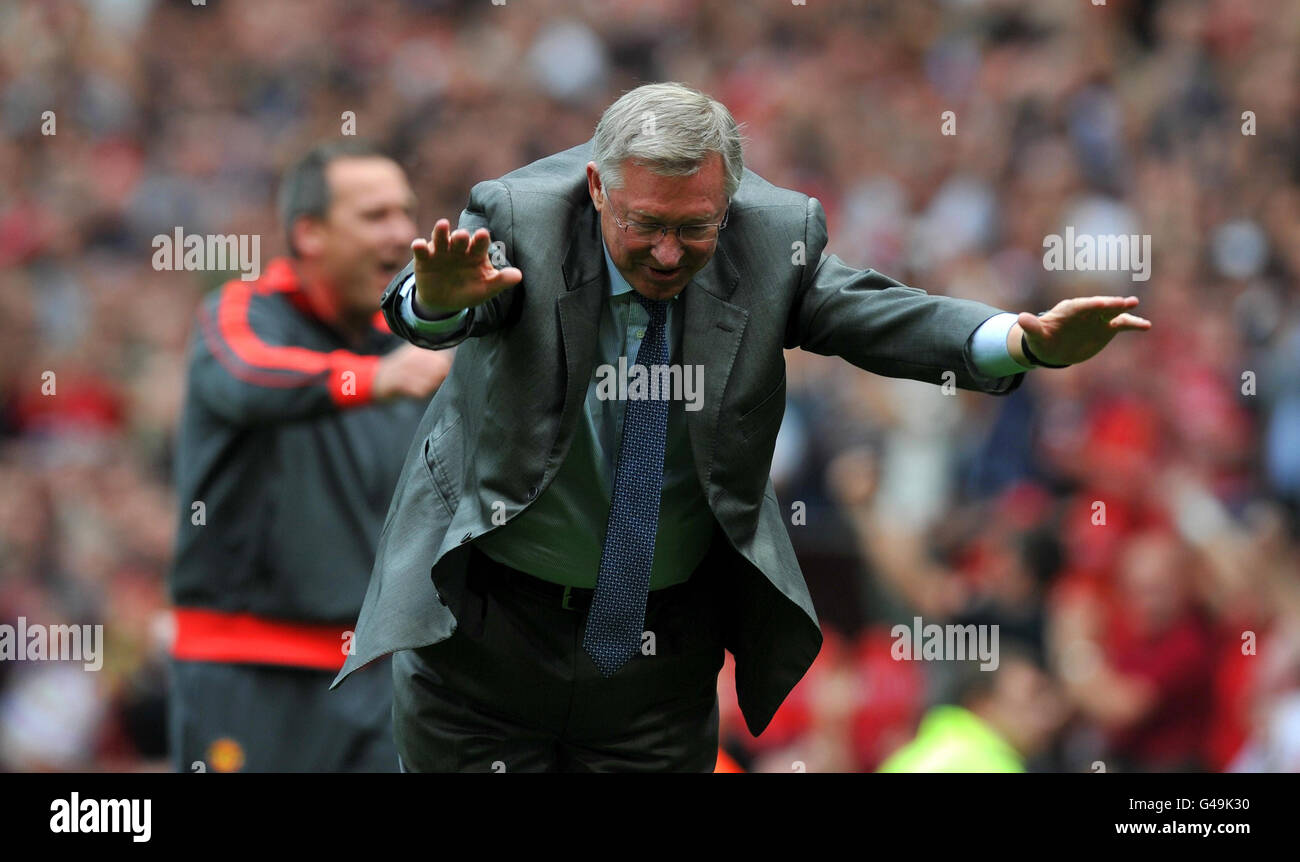 Manchester United manager Sir Alex Ferguson bows to the fans after the final whistle during the Barclays Premier League match at Old Trafford, Manchester. Stock Photo