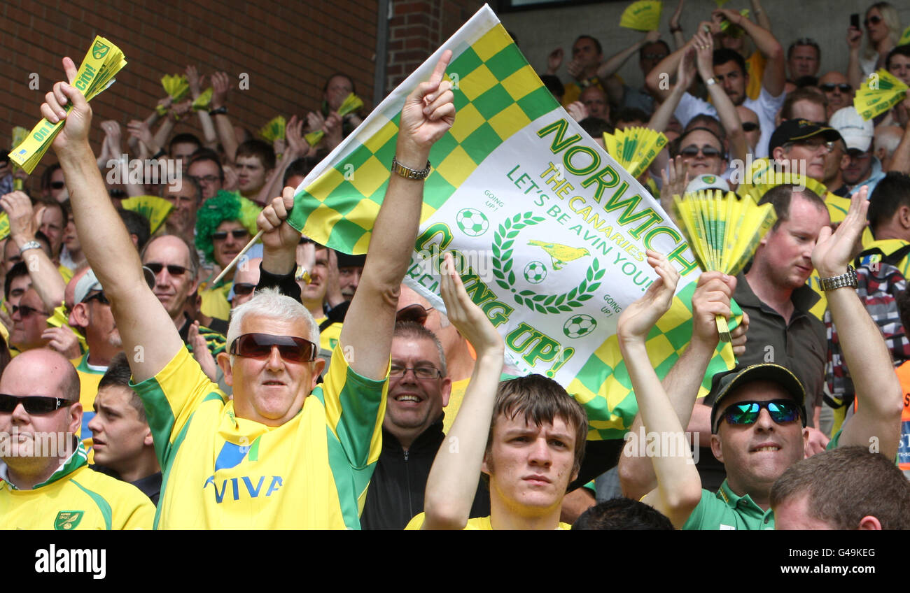 Norwich City fans celebrate their teams promotion to the Premiership at Carrow Road Stock Photo