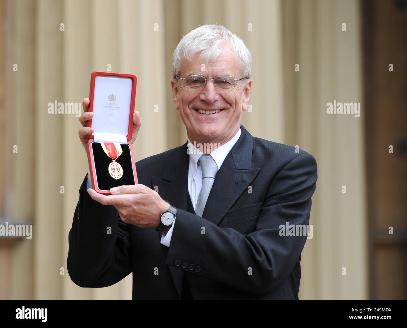 Sir Richard Lambert, Director General of the CBI, poses in the Quadrangle of Buckingham Palace, London after receiving his Knighthood from The Prince of Wales, London. Stock Photo