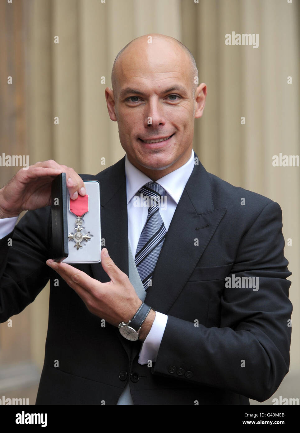 World Cup Referee Howard Webb poses in the Quadrangle of Buckingham Palace, London after being presented with a Member of the British Empire (MBE) medal by the Prince of Wales. Stock Photo
