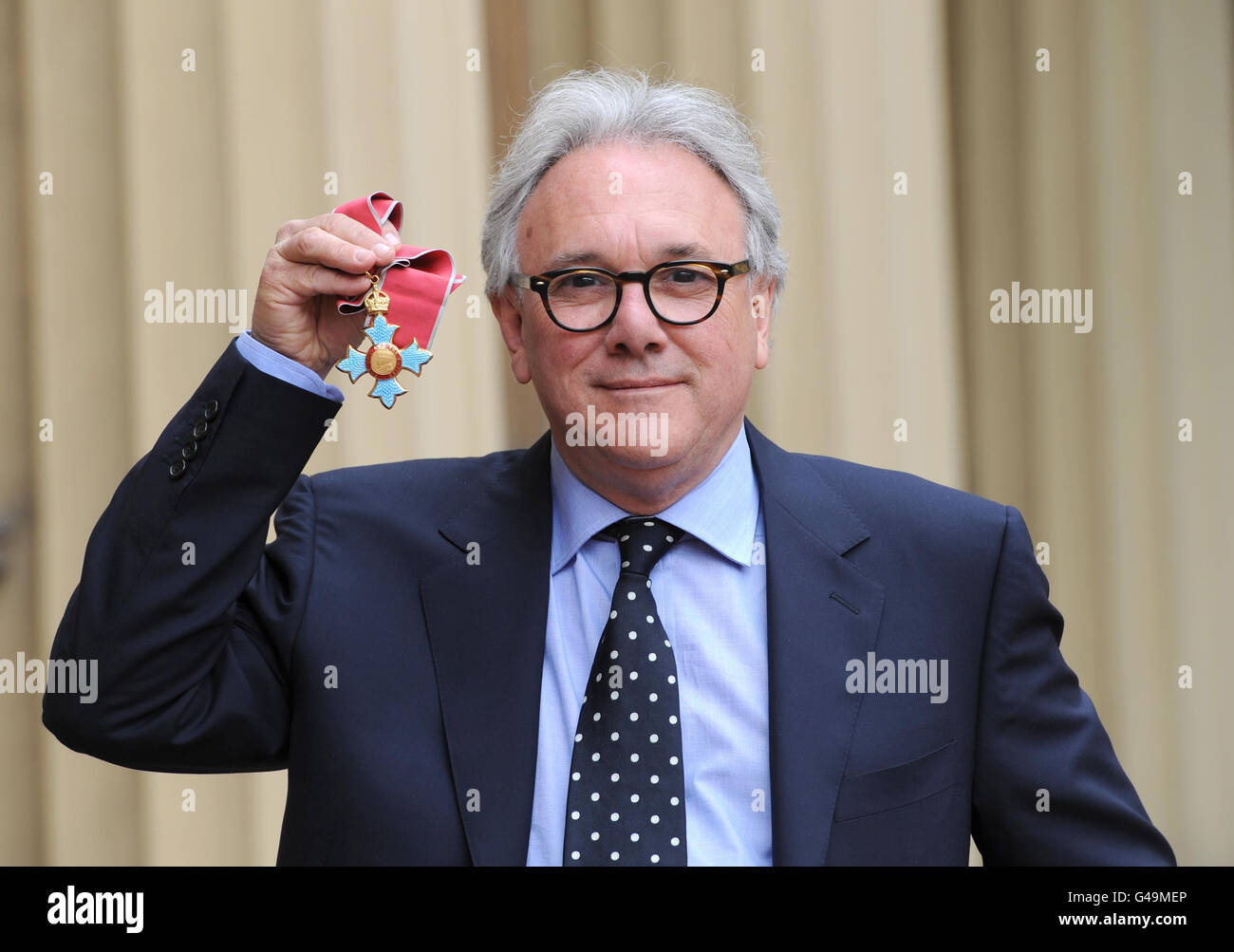 Record producer Trevor Horn poses in the Quadrangle of Buckingham Palace,  London after being presented with a Commander of the British Empire (CBE)  by the Prince of Wales Stock Photo - Alamy