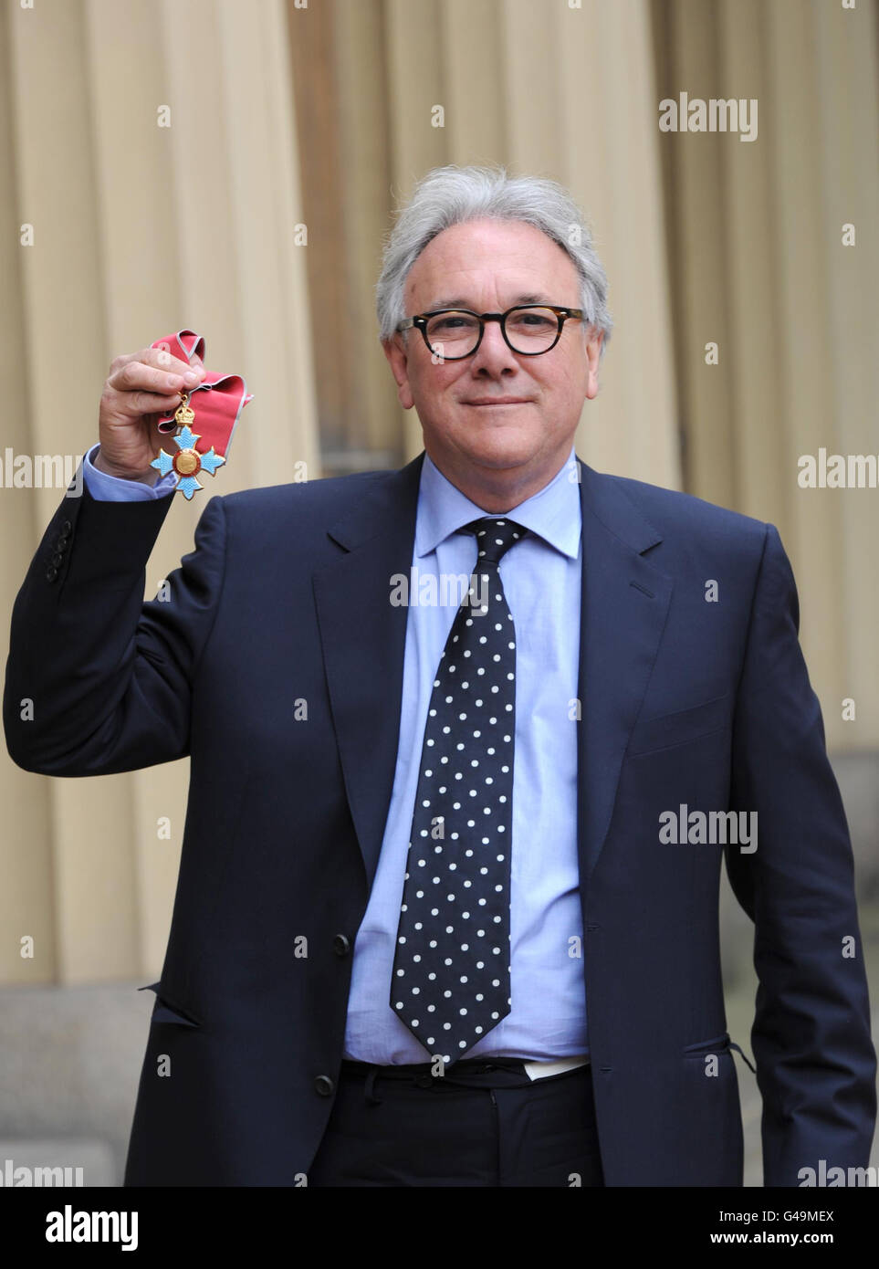 Record producer Trevor Horn poses in the Quadrangle of Buckingham Palace, London after being presented with a Commander of the British Empire (CBE) by the Prince of Wales. Stock Photo