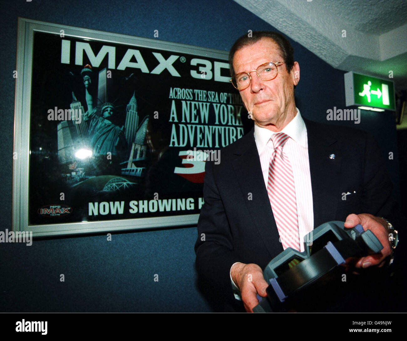 Bond hero Roger Moore, who proved a fan of the big screen at the launch of Europe's most advanced cinema which opens to the public today (Wednesday) in London's Pepsi Trocadero. More than 6 million has been invested in the giant Imax three-dimensional screen. A library of 150 action films are available with film-goers wearing special headsets to enjoy the three and two-dimensional movies. One features a visual journey through New York past and present including a roller coaster ride and vertigo-inducing descent from a skyscraper. PA Photo. See PA story SHOWBIZ Cinema Stock Photo