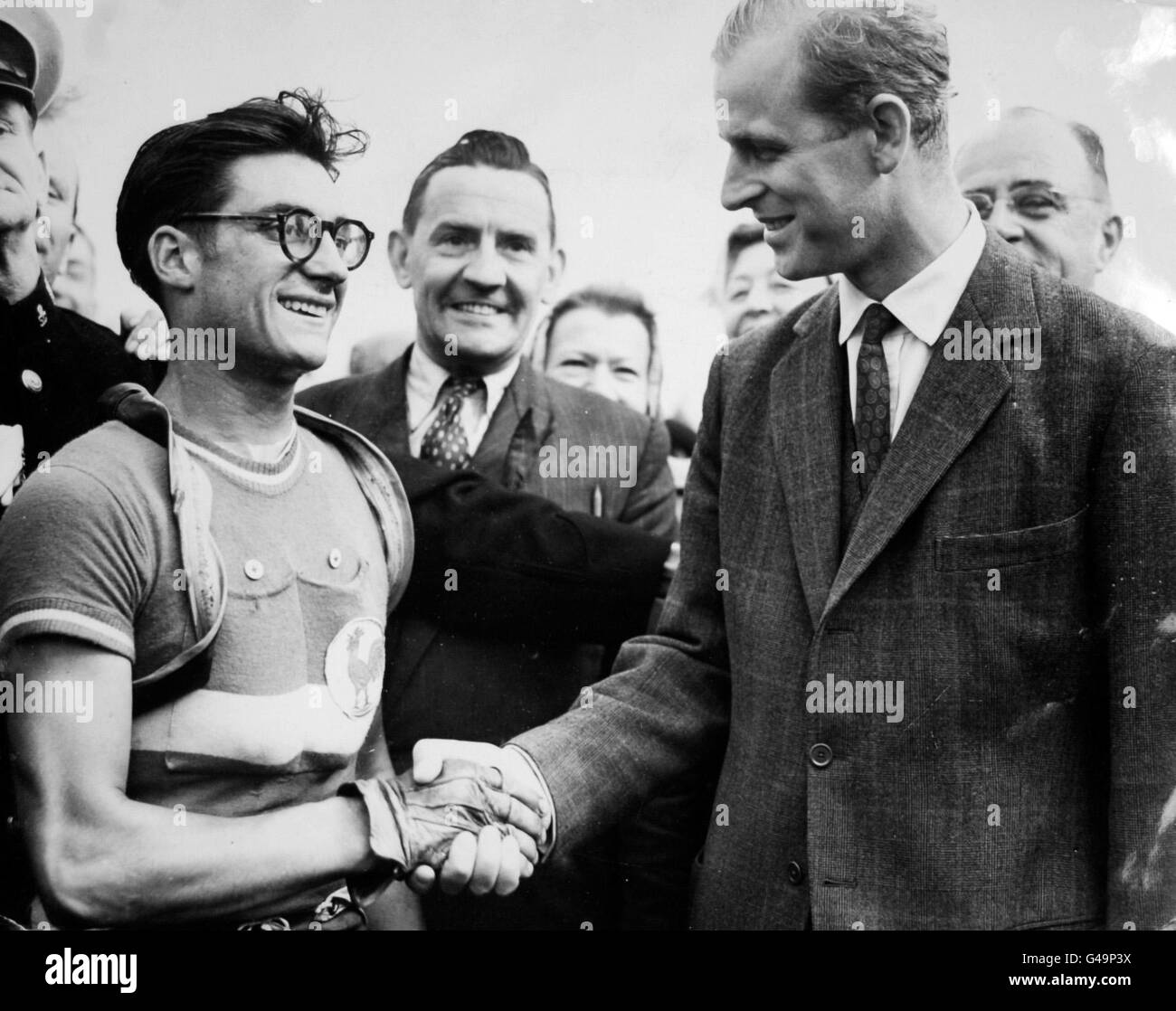 Cycling - Cycle Road Race - Windsor. The Duke of Edinburgh shakes hands with Jose Beyaert of France who won the gruelling 20-mile cycle road race at Windsor Stock Photo