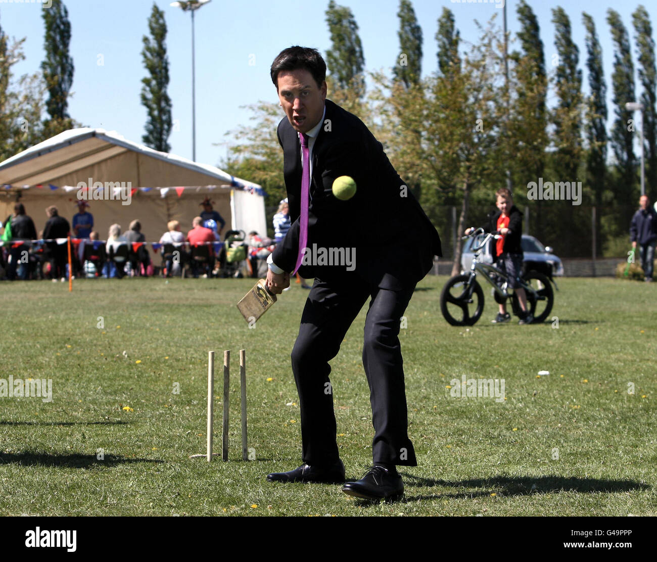Local Elections. Labour leader Ed Miliband plays cricket during an election visit to Kirkby in Ashfield, Nottinghamshire. Stock Photo