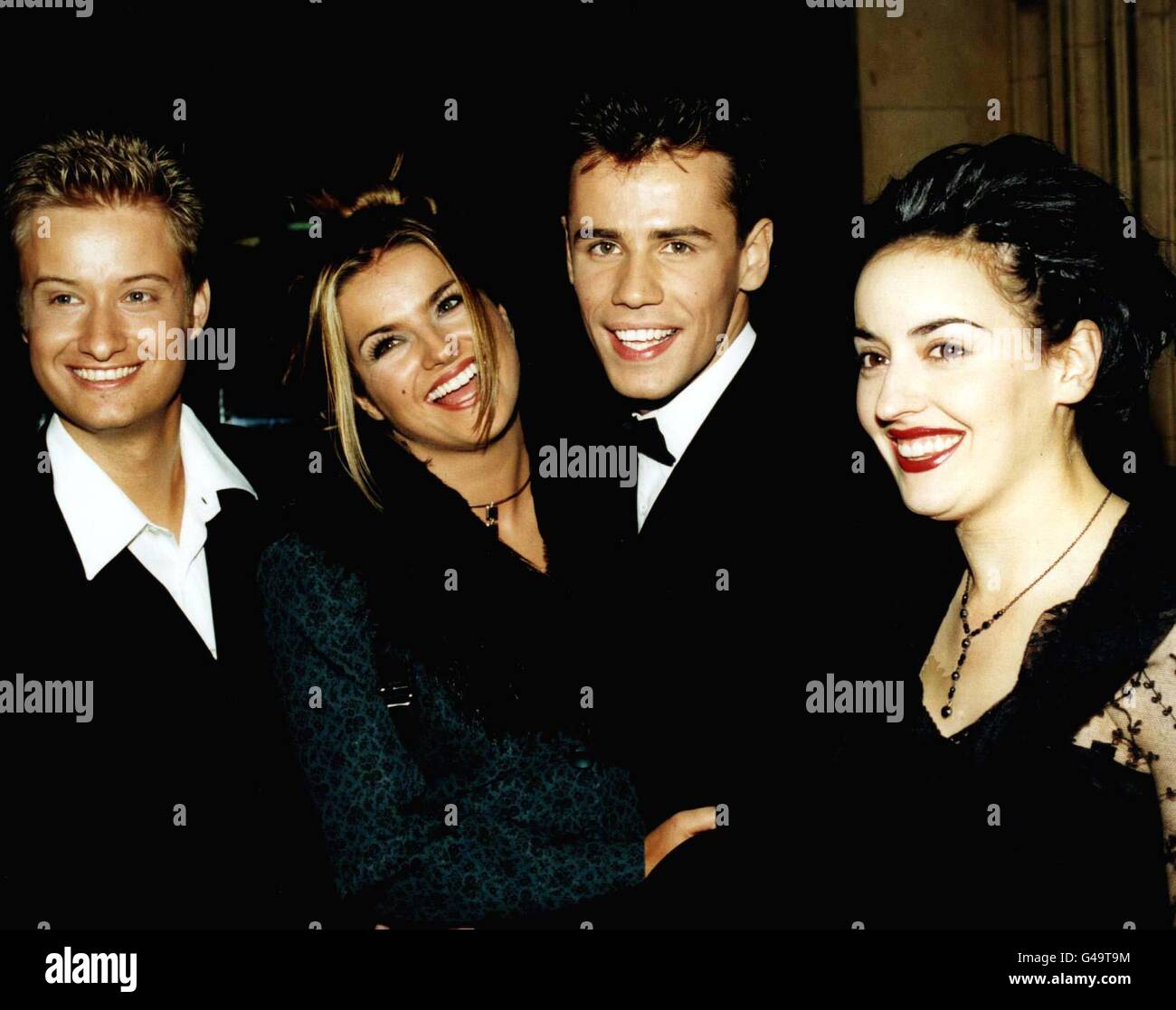 PA NEWS PHOTO 7/10/97 THE BLUE PETER TEAM (LEFT TO RIGHT) STUART MILES, KATY HILL, RICHARD BACON AND ROMANA ANNUNZIO AT THE NATIONAL TELEVISION AWARDS AT THE ROYAL ALBERT HALL IN LONDON Stock Photo