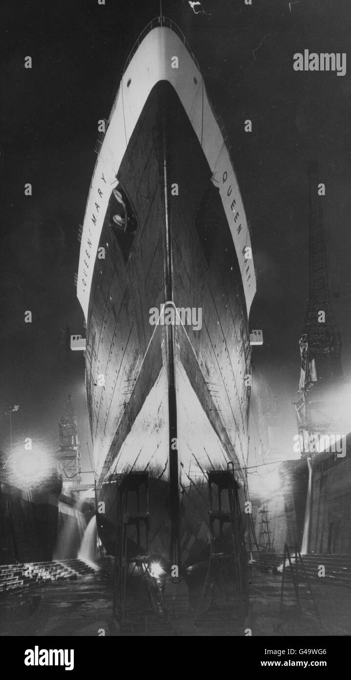 An impressive night picture of the 85,000 ton Cunard-White Star liner RMS Queen Elizabeth in the Graving Dock at Southampton. Stock Photo