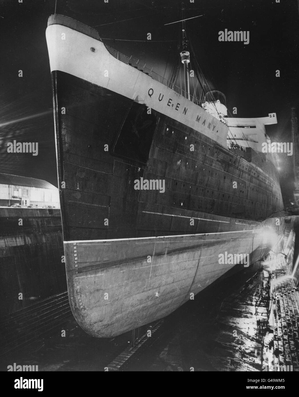 The giant Cunard-White Star liner RMS Queen Mary in the King George V dry dock at Southampton, for her annual inspection. Stock Photo