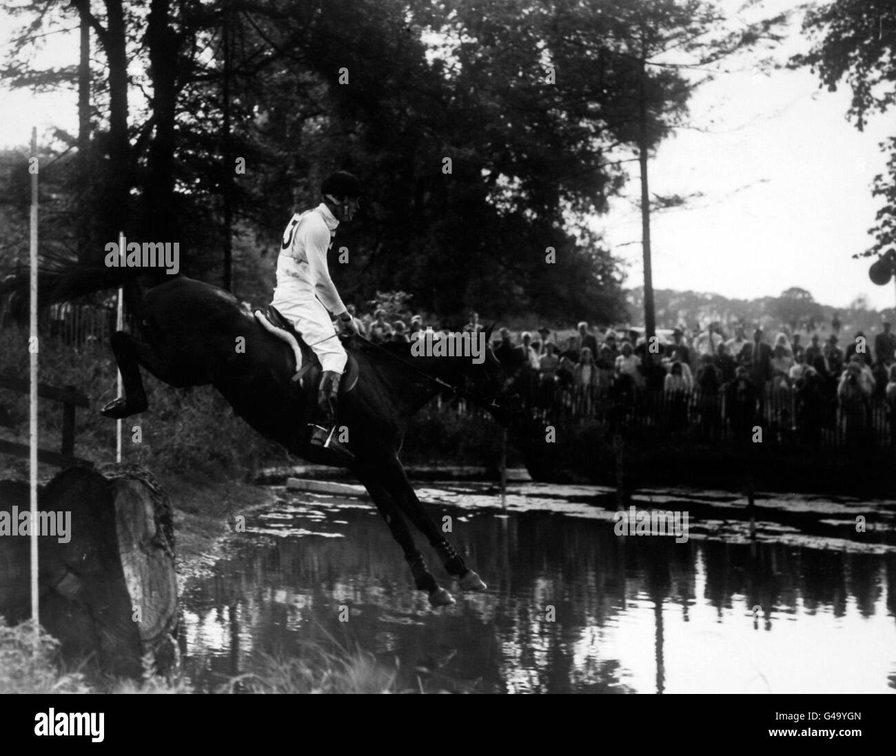 Equestrian - Burghley Three Day Event Horse Trials - Second Day - Cross Country. Richard Meade, who won the cross-country on 'Barberry', jumps into the water at fence 22 Stock Photo