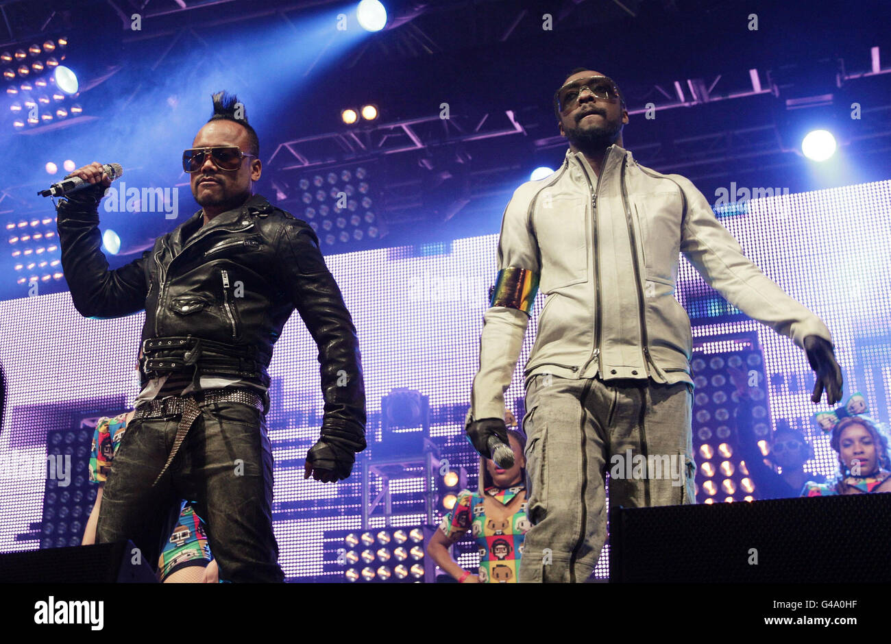 Apl.de.ap (left) and Will.i.am of the Black Eyed Peas performing on the Main Stage at BBC Radio 1's Big Weekend, held at Carlisle Airport. Stock Photo