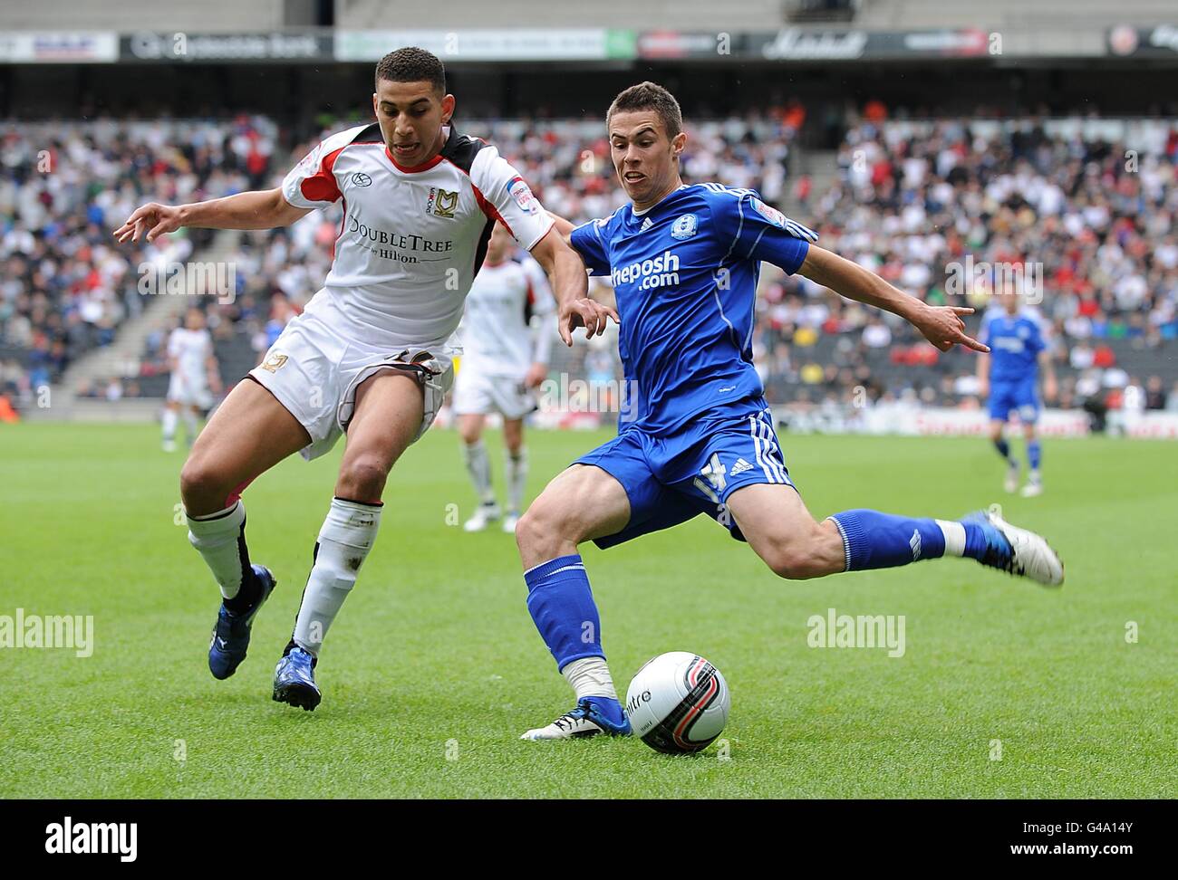Soccer - npower Football League One - Play Off Semi Final - First Leg - Milton Keynes Dons v Peterborough United - stadium:mk. Milton Keynes Dons' Daniel Powell (left) battles for the ball with Peterborough United's Tommy Rowe Stock Photo