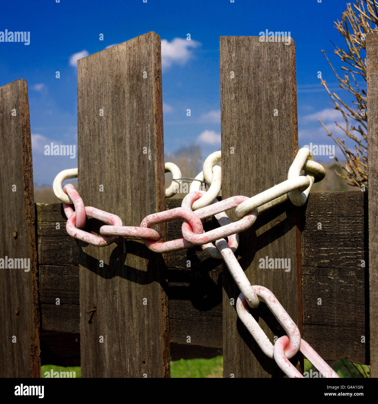 Chain around a wooden fence Stock Photo