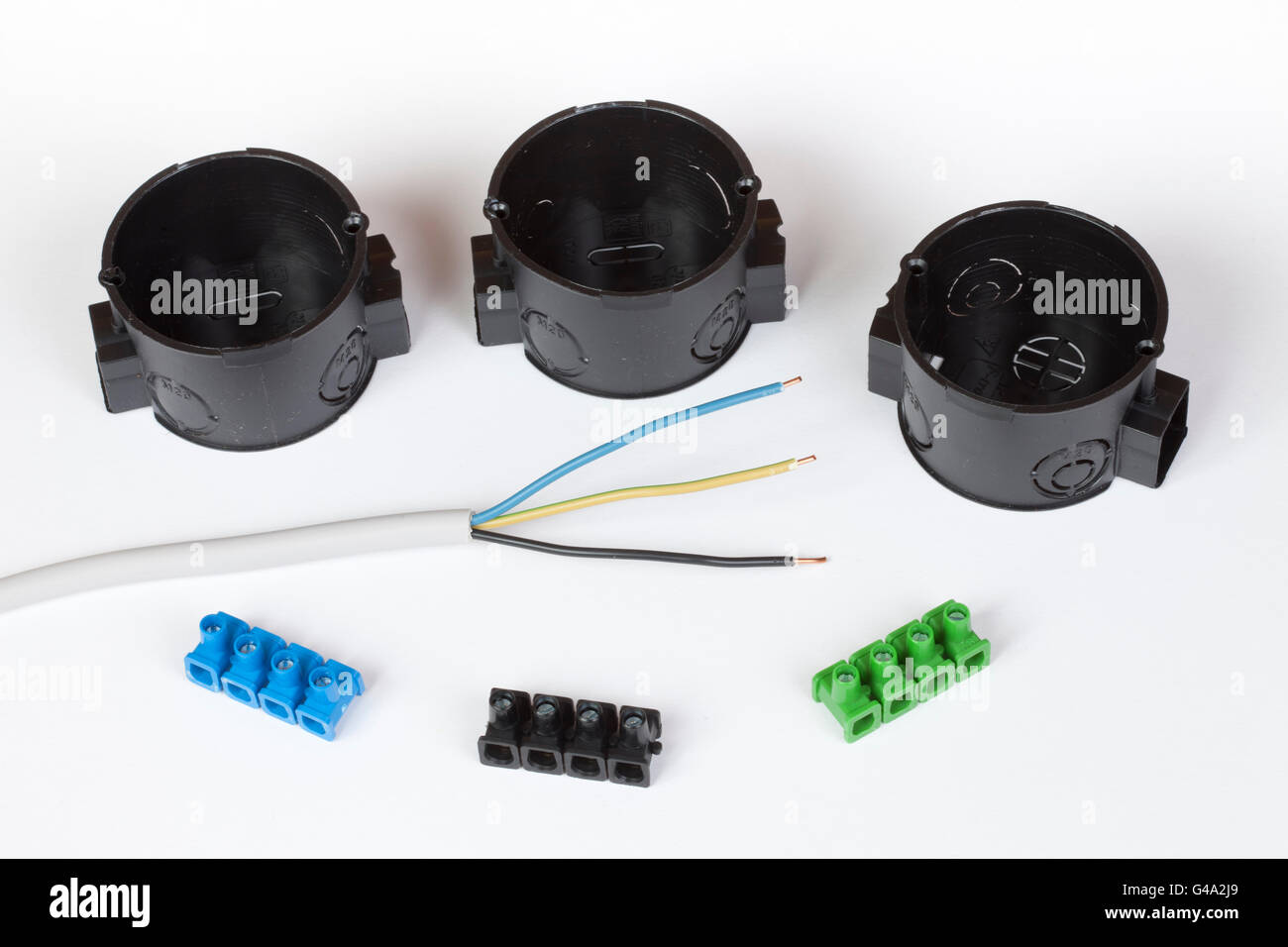 Flushmounted switch boxes, a power cable and wire connectors Stock