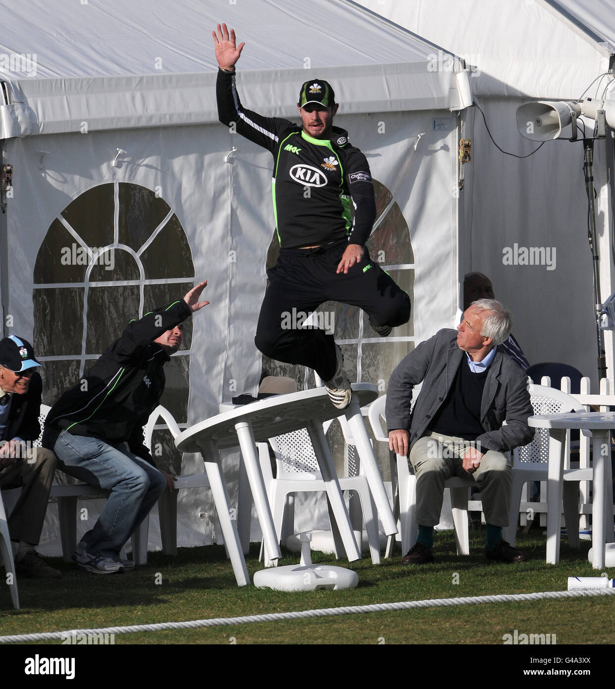 Surrey's Tom Maynard fails in his attempt at taking a catch on the boundary against Hampshire. Stock Photo
