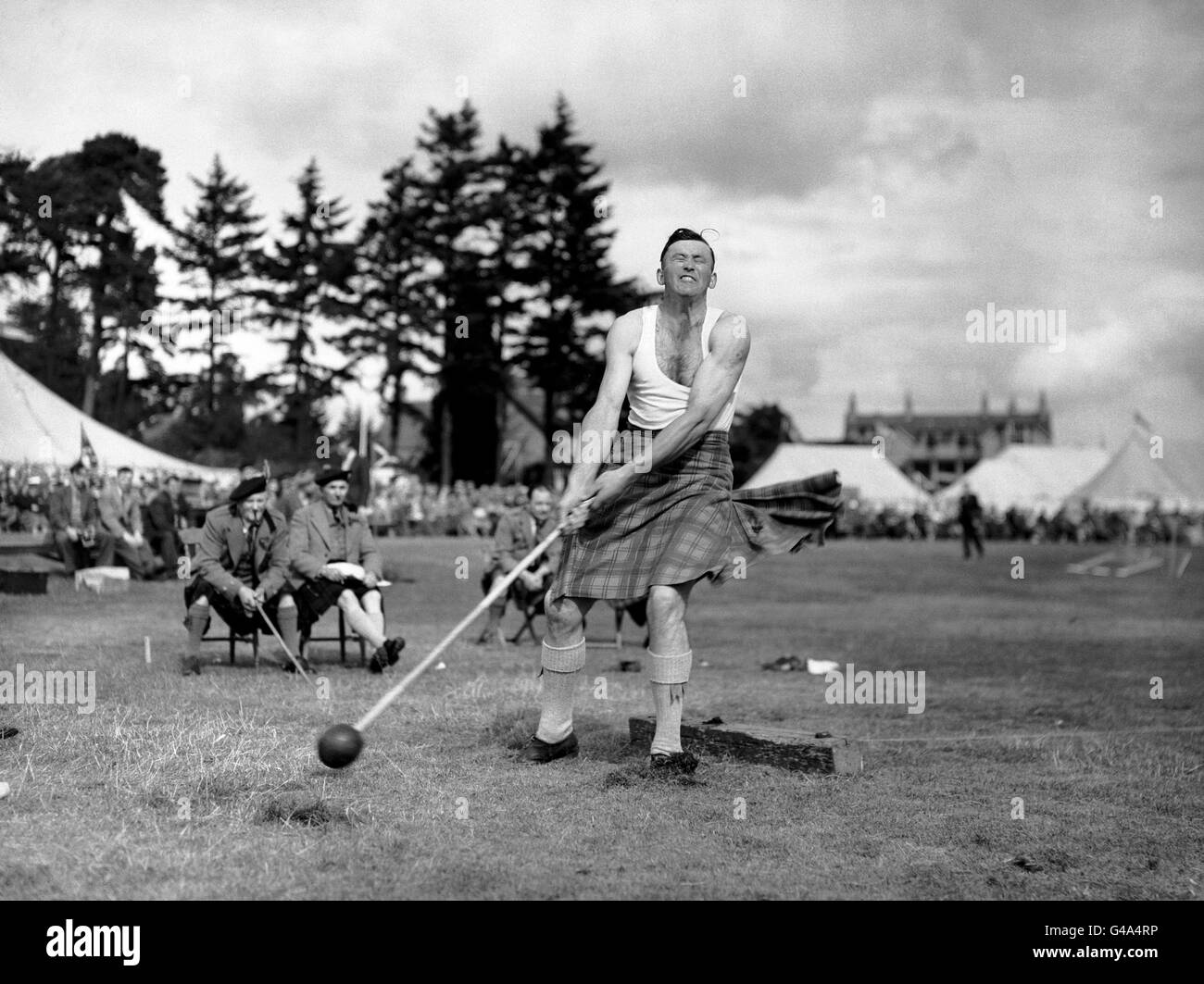 H.A Gray throws the heavy hammer 96ft 8 1/2 inches to break his own record Stock Photo