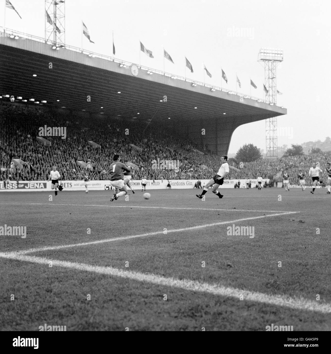 PA NEWS PHOTO : 12/7/66 : WEST GERMANY RIGHT HALF FRANZ BECKENBAUER FLIPS THE BALL OVER SWITZERLAND GOALKEEPER CHARLES ELSENER TO SCORE THE FOURTH GOAL IN THE 5-0 WORLD CUP MATCH VICTORY AT HILLSBOROUGH. Stock Photo