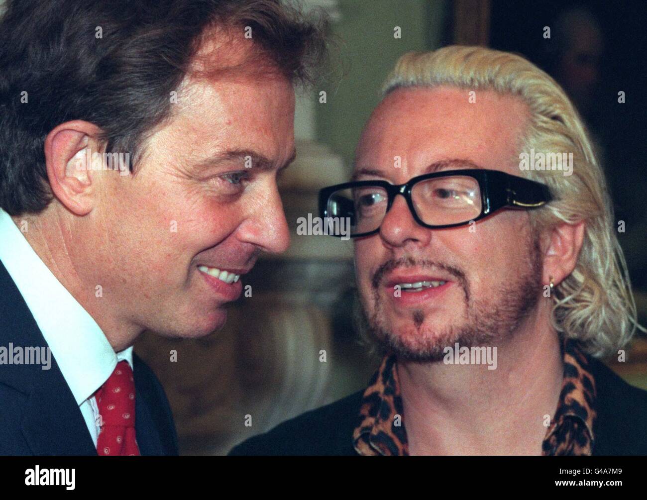 Musician Dave Stewart, founder of the group The Eurythmics, talks with British Prime Minister Tony Blair during a showbiz party at No.10 Downing Street this evening (Wednesday). Some 150 guests took part in the glittering gathering. Stock Photo