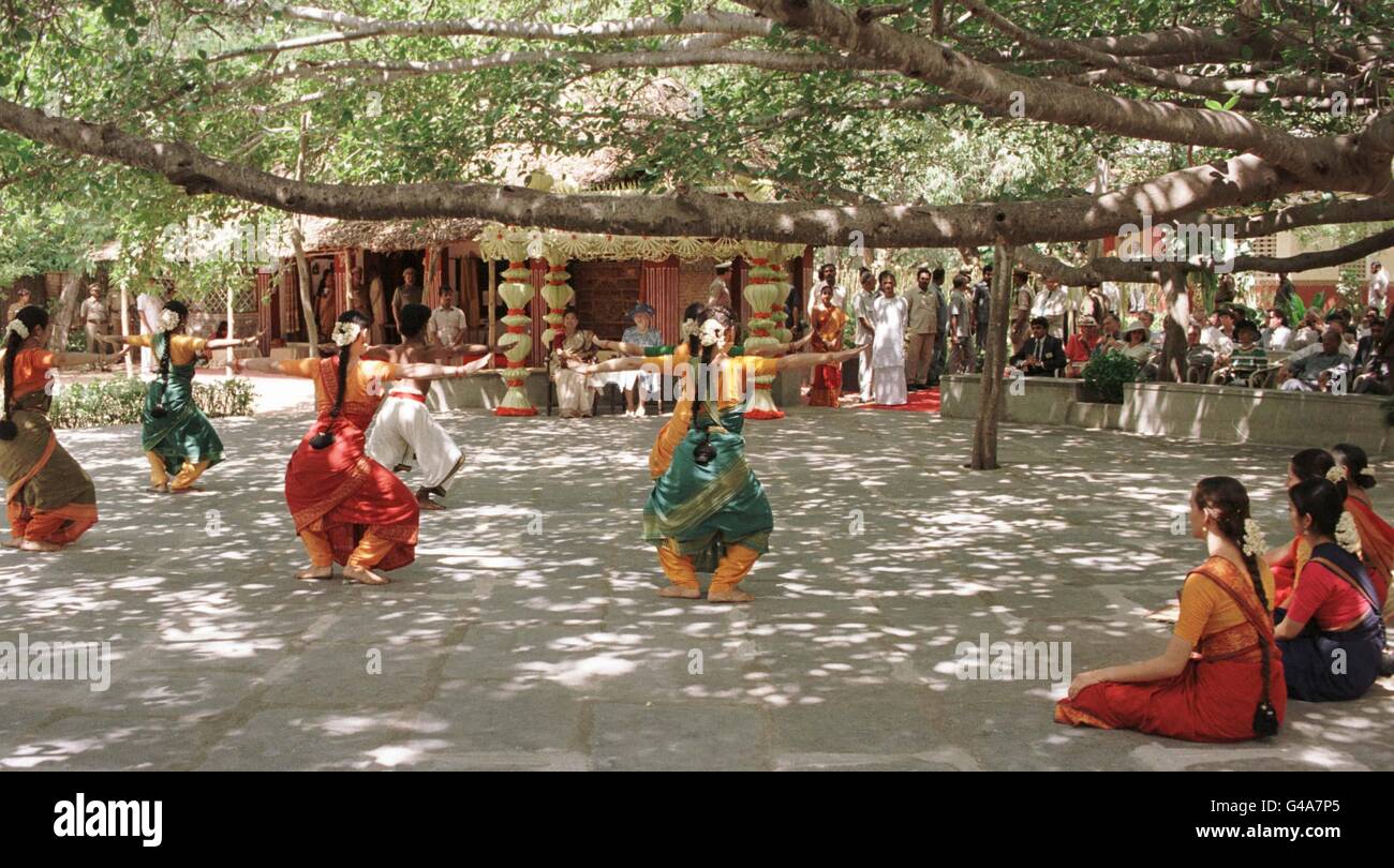 The Queen watches a display of dancing under the shade of a giant Banyan tree, at the Kalakshetra Foundation on the outskirts of Chennai (formerly Madras) Stock Photo