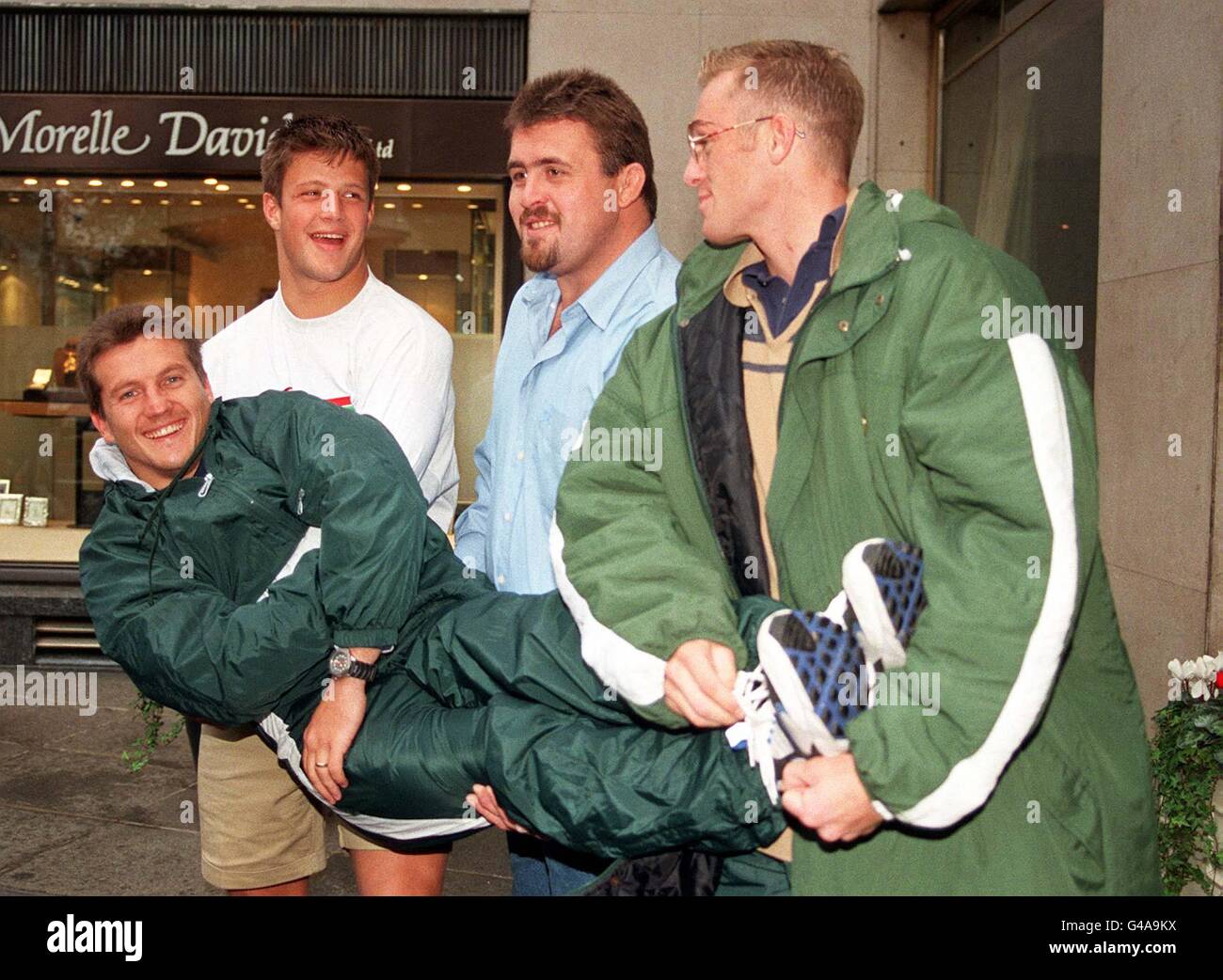 South African rugby players (from left) Bobby Skinstad, Willie Mayer and Percy Montgomery lift team mate Dan Van Zyl during a photocall in London to announce the team for Saturday's clash against England at Twickenham. Stock Photo