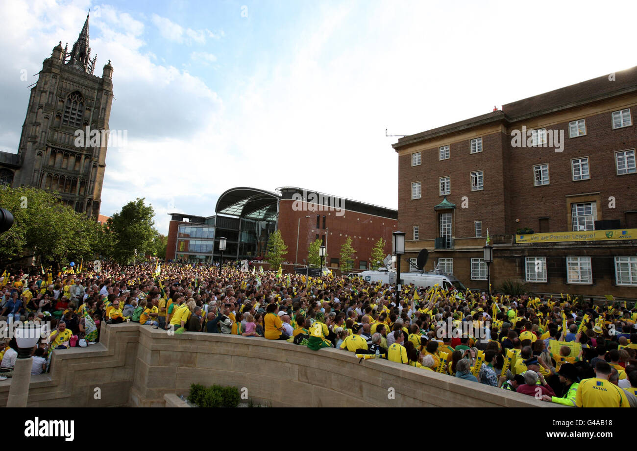 Norwich City fans celebrate during an open top bus tour as they