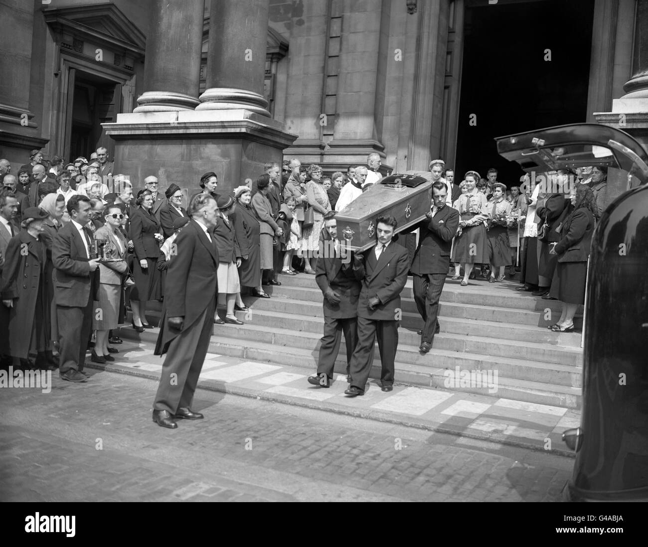 Decorations awarded to Countess Teresa Lubienska, murdered heroine of the Polish resistance, are seen on her coffin as it is borne from Brompton Oratory after the Requiem Mass. The 77 year old Countess, was stabbed to death at Gloucester Road Underground station on Friday May 24th 1957, was posthumously awarded the Golden Cross of Merit with Swords for her services to the Polish resistance movement. After the Requiem Mass the coffin was taken to Brompton Cemetery for interment. Her killer was never caught. Stock Photo