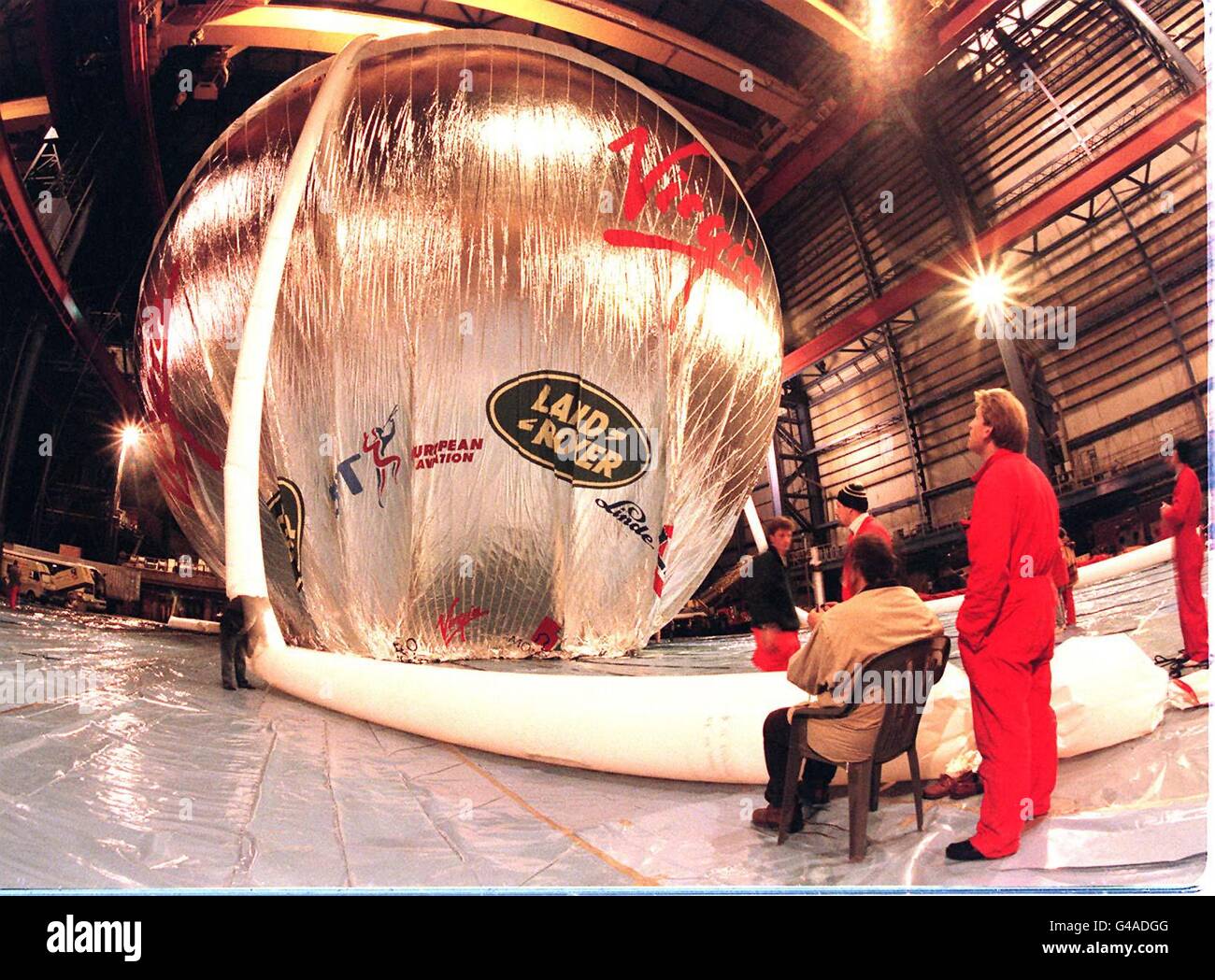 Under pressure, engineers at the critical moment of pressure testing the new Virgin Global Challenger balloon in the old Cammel Laird shipbuilding shed at Birkenhead yesterday evening (Saturday). The new envelope passed with flying colours and is now headded for Richard Bransons Marrakesh launch site in Morocco. Photo Chas Breton. Stock Photo