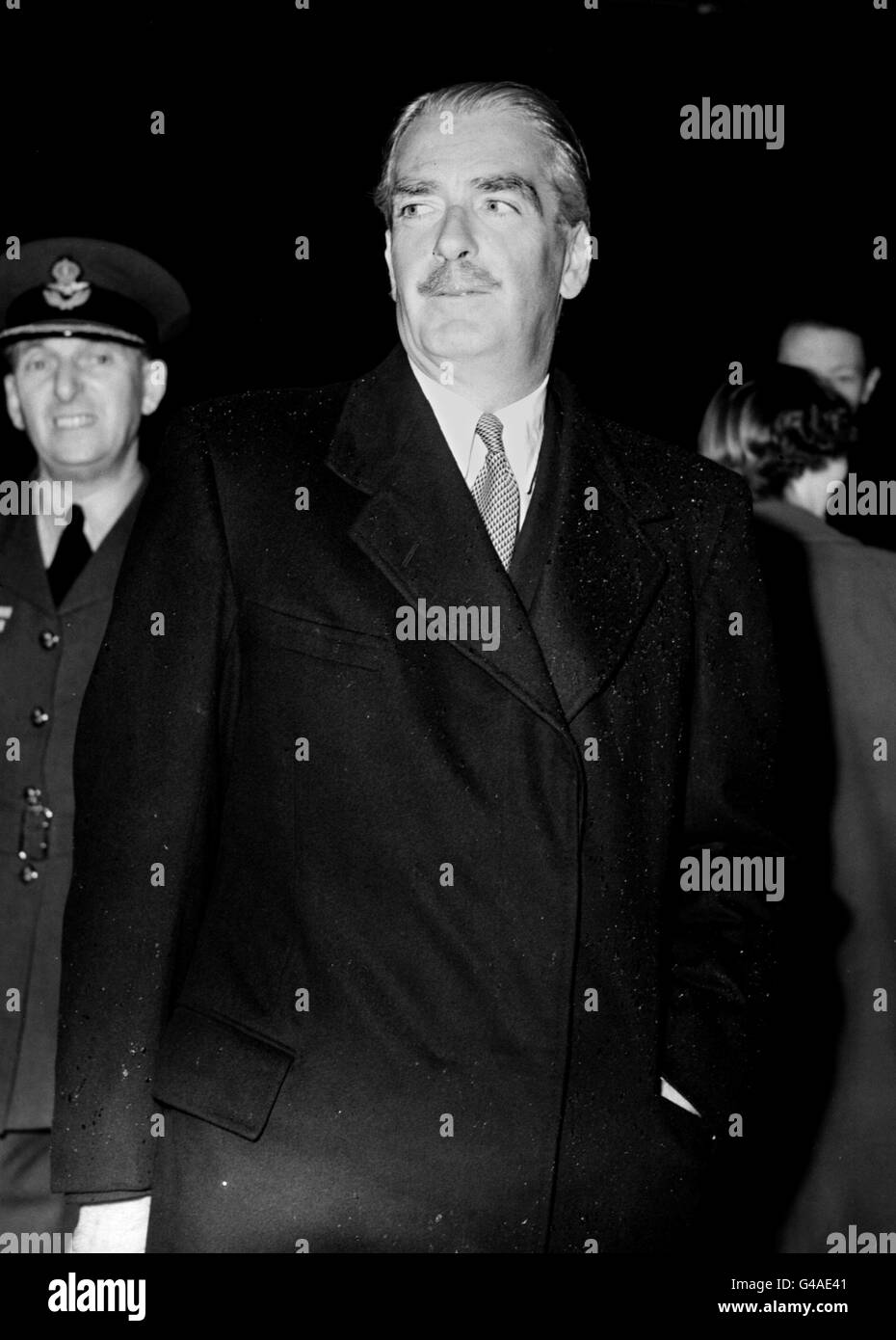 BRITISH FOREIGN MINISTER ANTHONY EDEN ARRIVES AT LONDON AIRPORT TODAY AFTER HIS PLANE HAD BEEN DELAYED BY BAD WEATHER FOLLOWING HIS FOURTEEN DAY VISIT TO JUGOSLAVIA AND AUSTRIA. MR. EDEN SAID HE WAS IMPRESSED BY THE DETERMINATION OF MARSHAL TITO AND THE JUGOSLAV LEADERS TO KEEP THEIR COUNTRY UNITED AND FREE Stock Photo