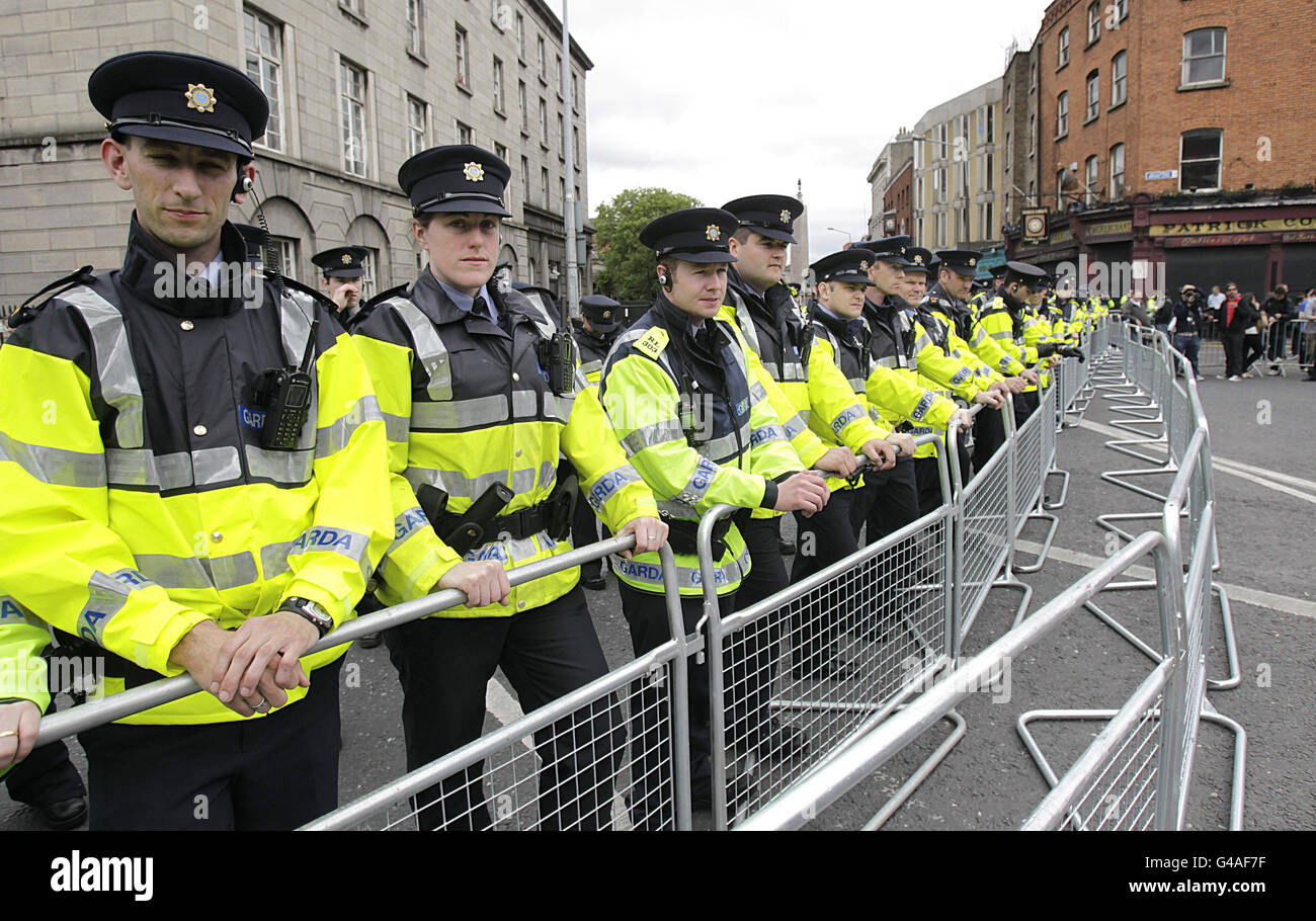 Garda are seen near the Garden of Remembrance in Dublin ahead of a visit by Britain's Queen Elizabeth II. Stock Photo