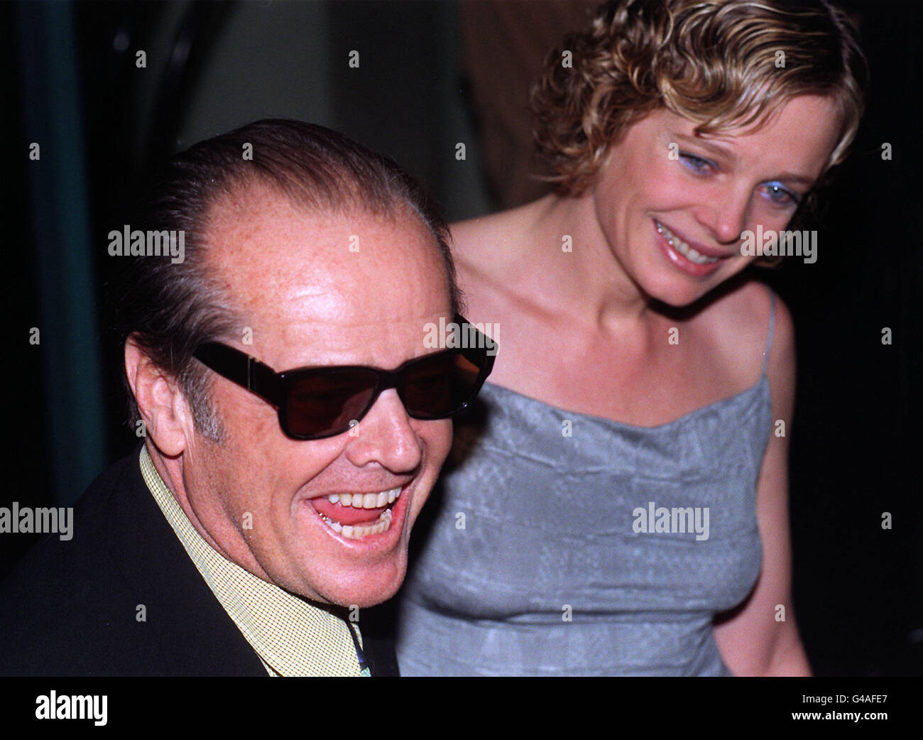 American actor Jack Nicholson accompanied by his girl-friend Rebecca Broussard, arrive at the Warner West End this evening (Thursday), for the London premiere of his latest film 'As Good As It Gets'. See PA Story SHOWBIZ Nicholson. Photo by Sean Dempsey/PA. Stock Photo