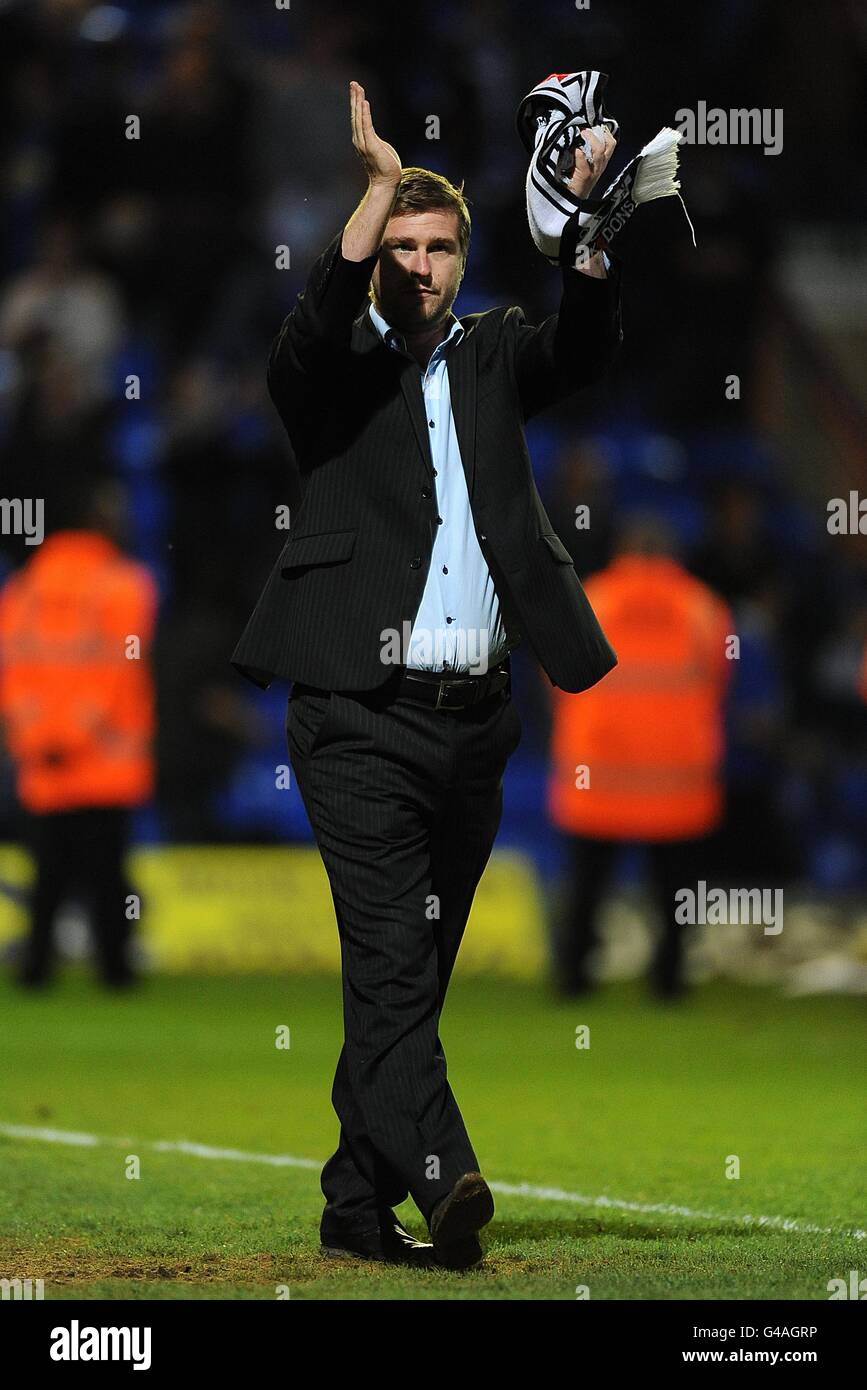 Milton Keynes Dons manager Karl Robinson on the pitch after the final whistle Stock Photo