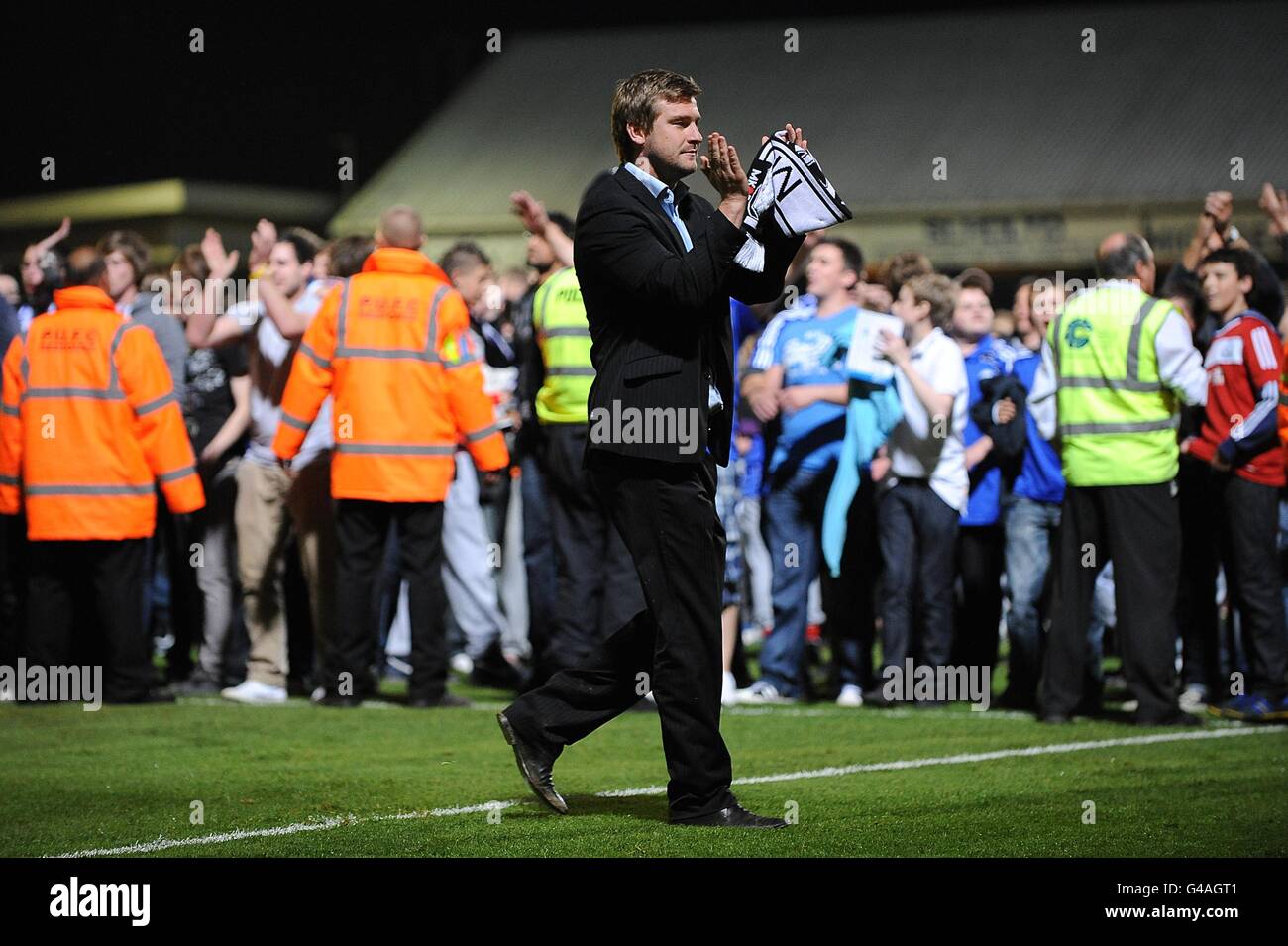 Milton Keynes Dons manager Karl Robinson on the pitch after the final whistle Stock Photo