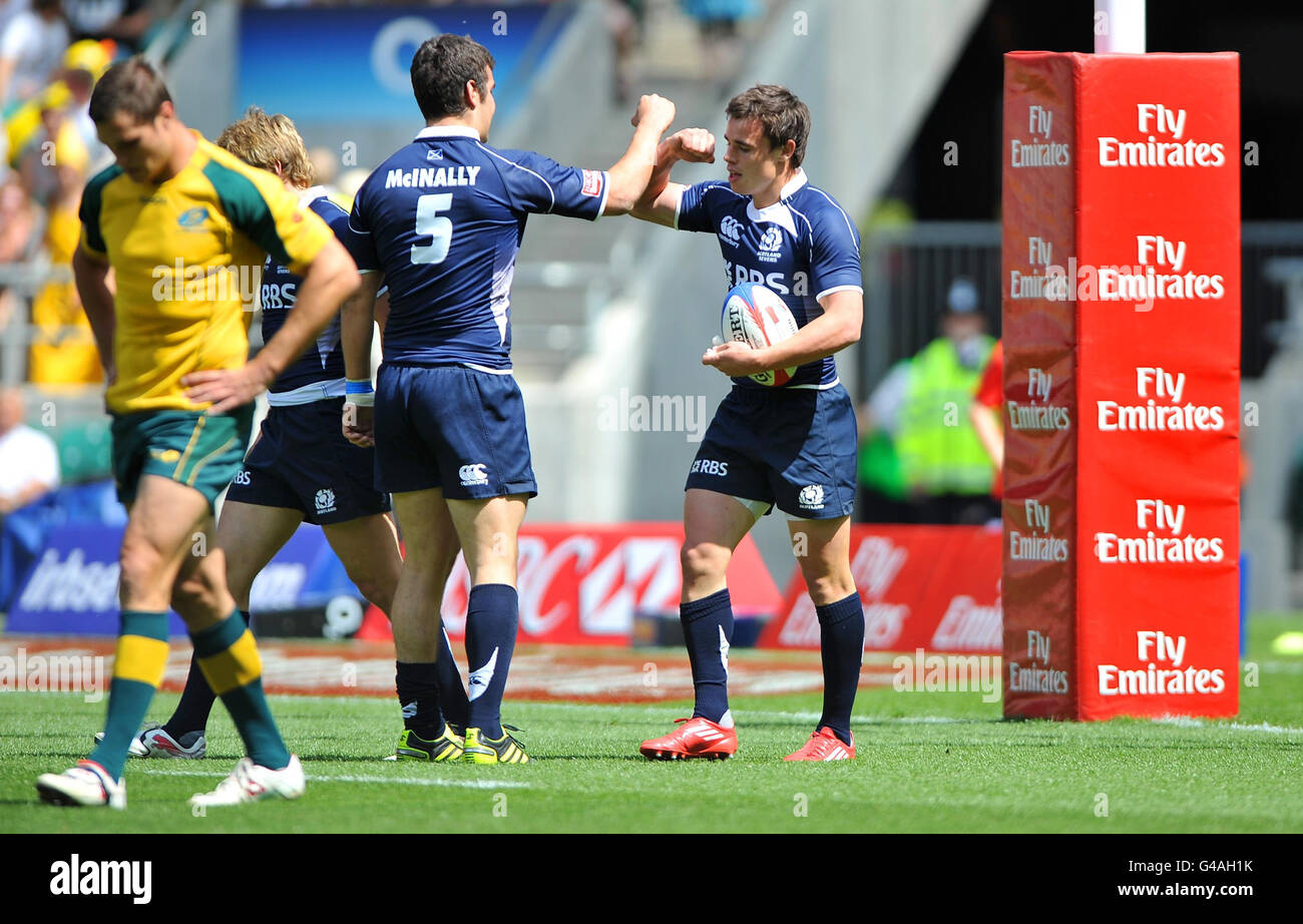Scotland's Lee Jones is congratulated by Stuart McInally after scoring a try of the IRB Emirates Airline London Sevens at Twickenham Stadium, London. Stock Photo