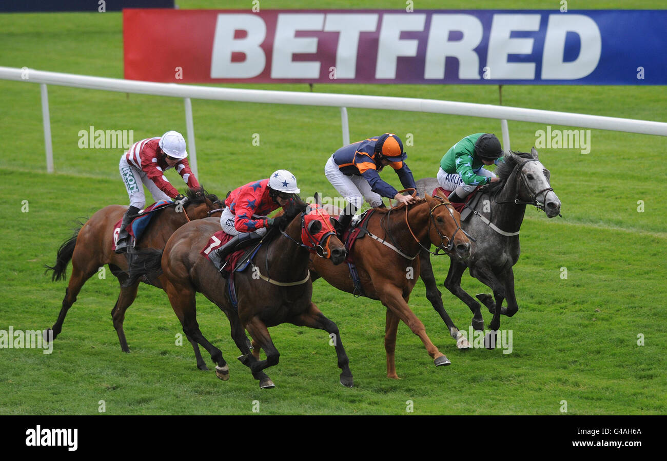 Dickie Le Davoir ridden by Robert Butler (number 7) wins the Betfred Text Fred to 89660 Handicap Stakes during the Betfred Silver Bowl and Temple Stakes Day at Haydock Racecourse, Merseyside. Stock Photo
