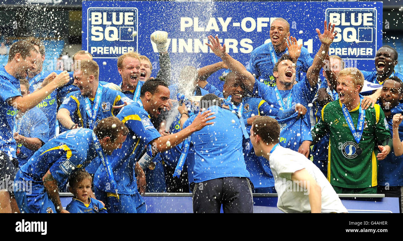 soccer-blue-square-natpub-half-length-mid-celebrating-champagne