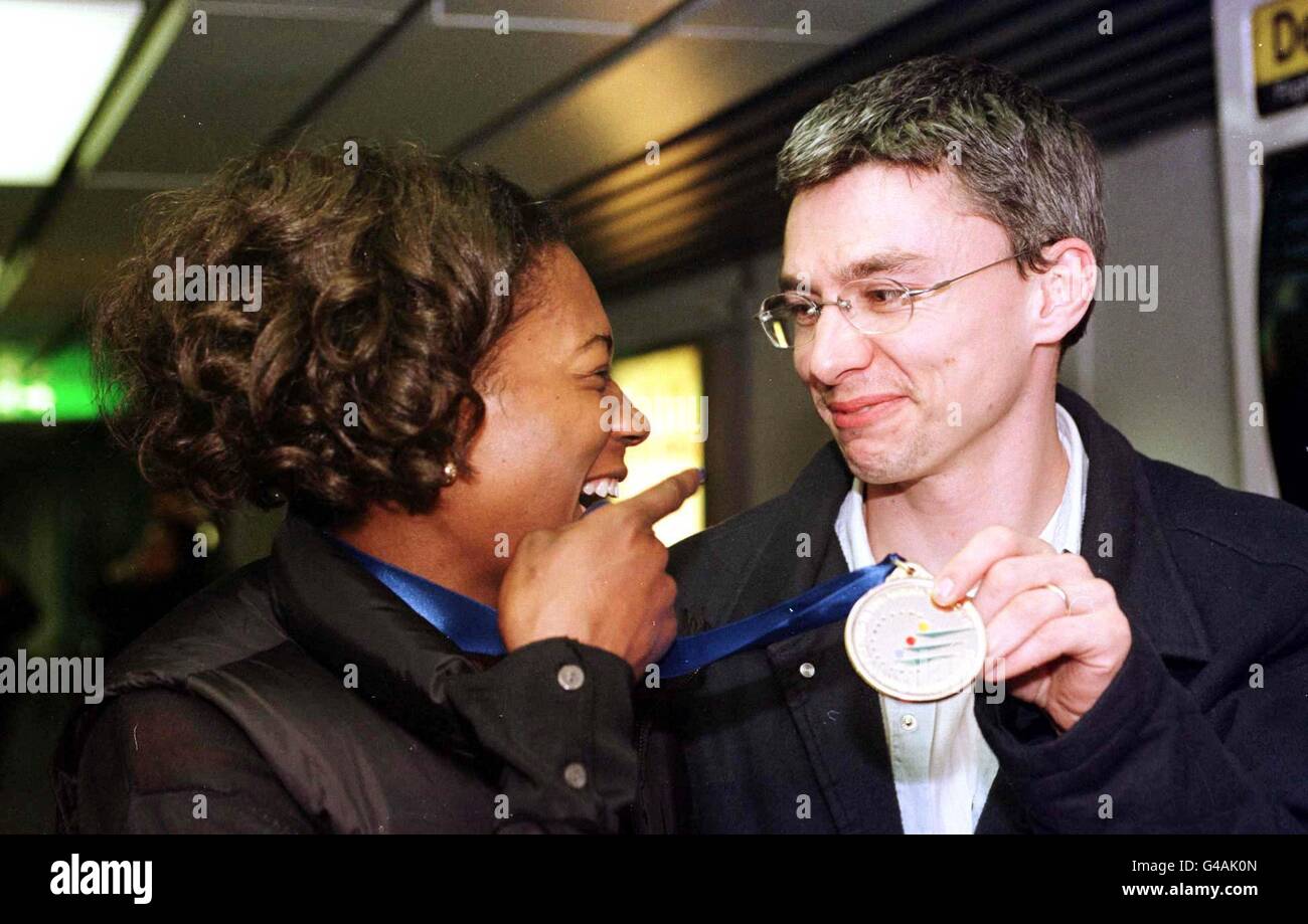 Gold Triple jumpers Jonathan Edwards & Ashia Hansen at Heathrow