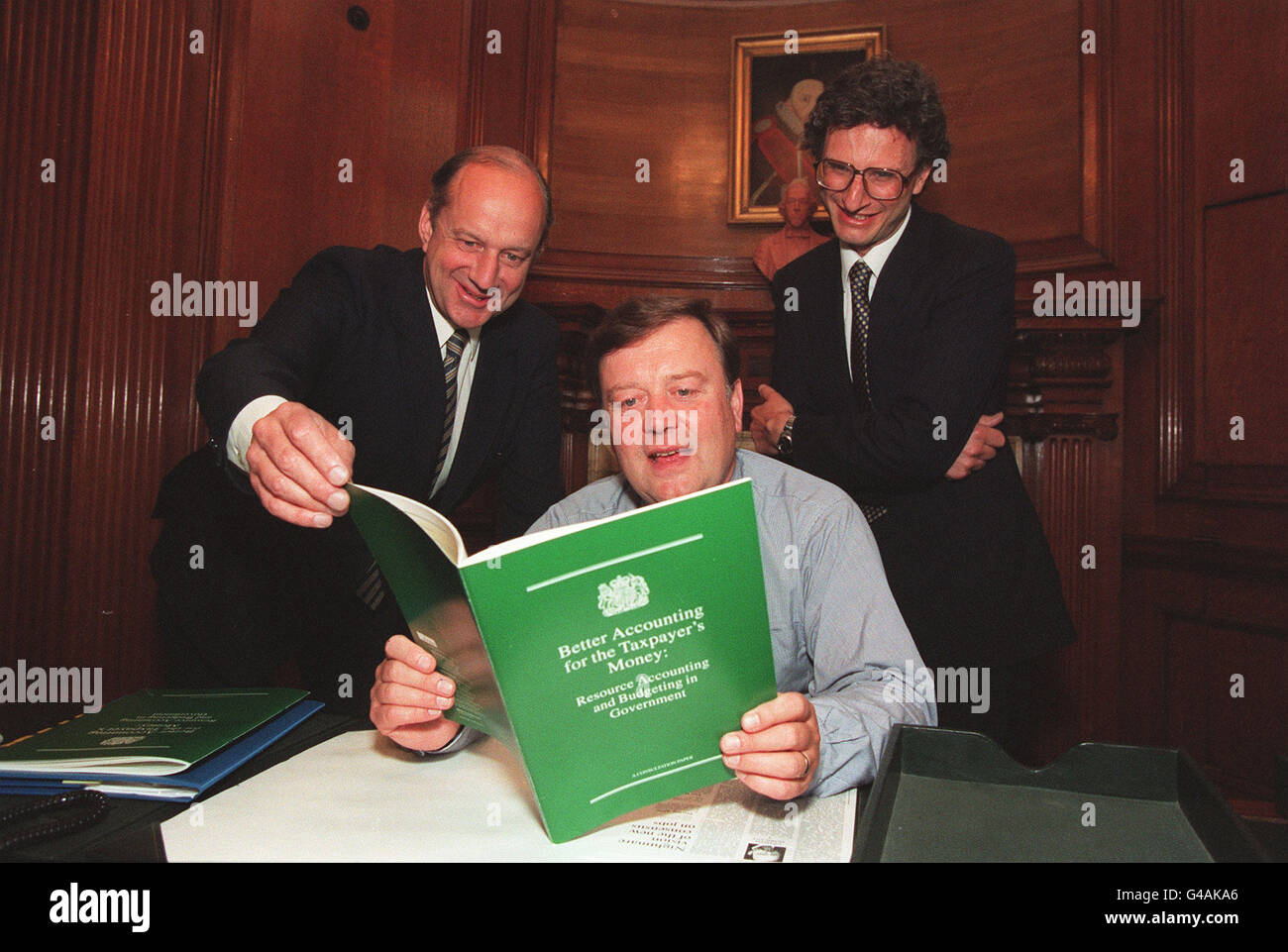 PA NEWS PHOTO 13/7/94 CHANCELLOR OF THE EX-CHEQUER KENNETH CLARKE (CENTRE) IS FLANKED BY PAYMASTER GENERAL SIR JOHN COPE (LEFT) AND GOVERNMENT CHIEF ACCOUNTANT ANDREW LIKIERMAN AT THE LAUNCH IN LONDON OF THE GREEN PAPER ON RESOURCE ACCOUNTING Stock Photo