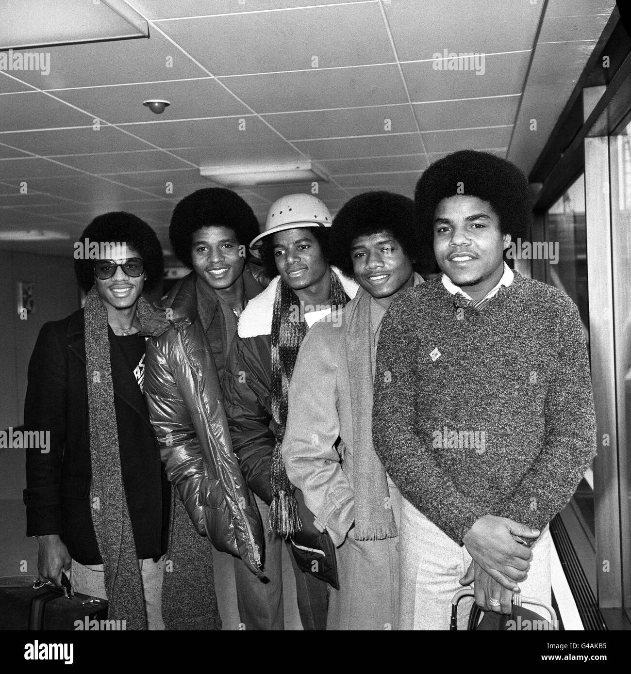Michael Jackson (centre) with his brothers L-R: Marlon, Jackie, Randy and Tito 'The Jackson Five' at Heathorw Airport, London arriving from Amsterdam for their British tour. Stock Photo