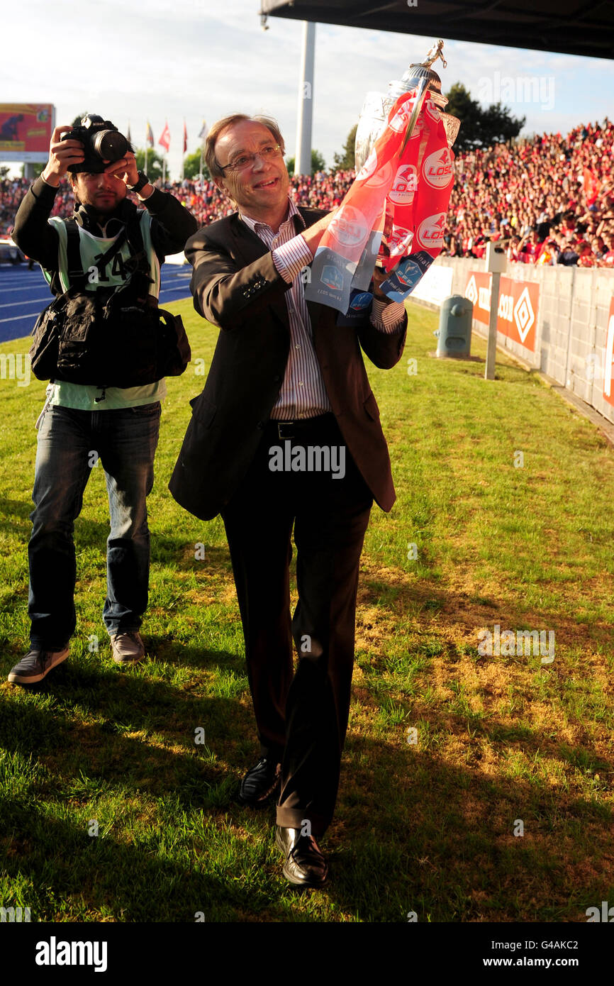 Lille president Michel Seydoux parades around the pitch with the Ligue 1 trophy Stock Photo