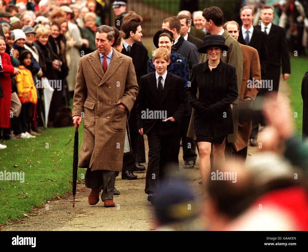 Prince Charles leads the with son Prince Harry and Zara Phillips as the Royals attend St. Mary Magdelene church on the Queen's Sandringham Estate in Norfolk today (Thursday) after attending morning service on their first Christmas Day since their mother, Diana, Princess of Wales died. See PA story ROYAL Christmas. WPA Rota picture by John Stillwell/PA Stock Photo