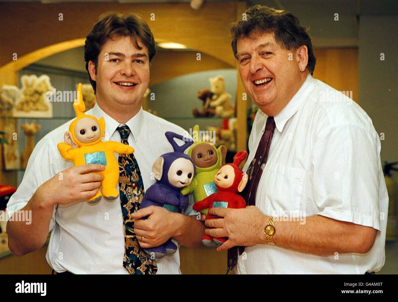 John Hales, chairman of toymakers Golden Bear Products, with son Robert (left) and Teletubbies in his factory showroom. Hales's plant in Telford, Shropshire cannot manufacture them quickly enough to satisfy overwhelming demand for Tinky Winky, Dipsy, Laa-Laa and Po. His company is shipping out 100,000 pieces a week and by Christmas Day over 1.2 million will have been sent out to the shops.See PA story RACING Hales. Photo by Rui Vieira/PA Stock Photo