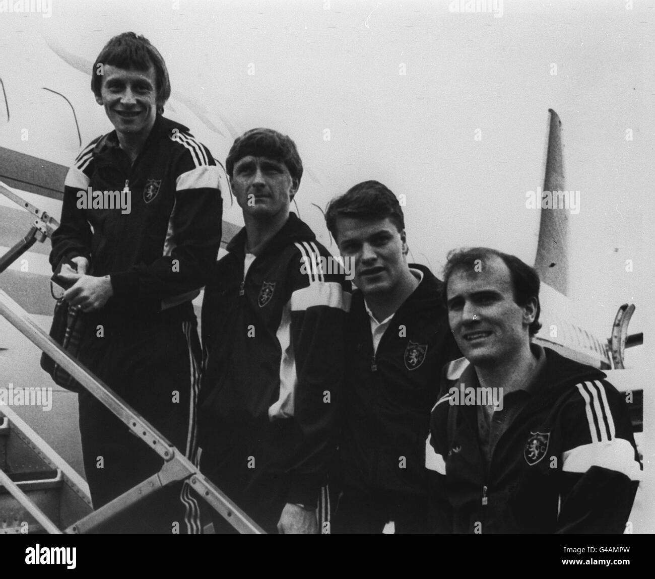 PA NEWS PHOTO 16/3/87  DUNDEE UNITED SOCCER PLAYERS FROM LEFT TO RIGHT: PAUL STURROCK, PAUL HEGARTY, JOHN CLARK AND EAMMON BANNON LEAVE GLASGOW AIRPORT FOR WEDNESDAY'S UEFA CUP QUARTER FINAL MATCH AGAINST BARCELONA. Stock Photo