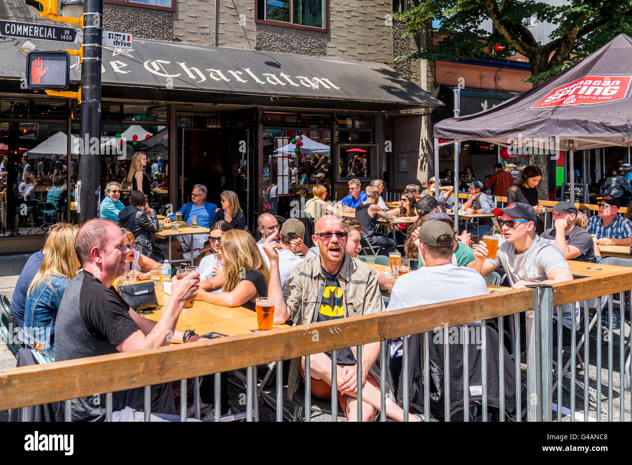 Busy restaurant patio, Commercial Drive, Vancouver, British Columbia, Canada Stock Photo