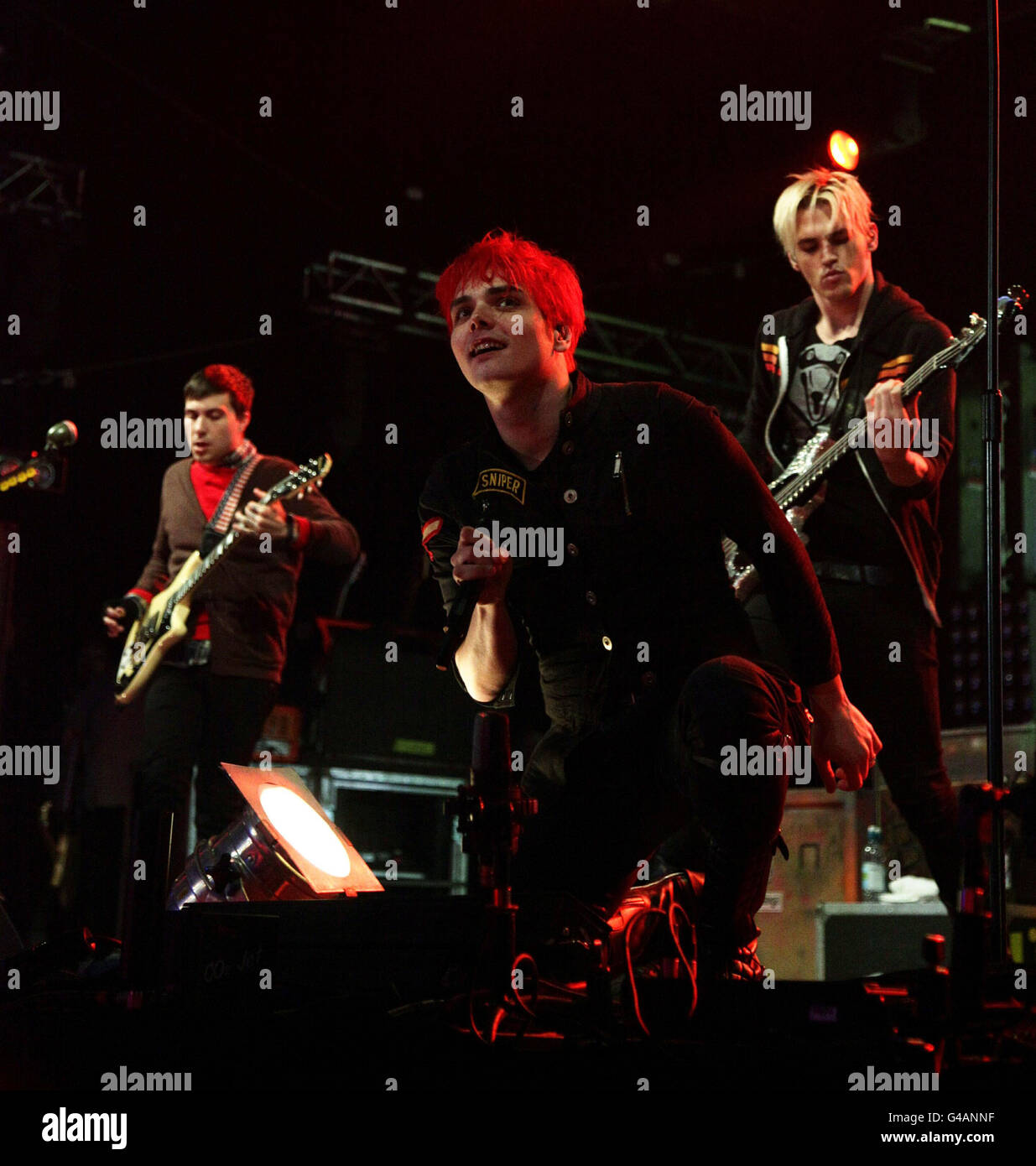 Gerard Way (centre) with bassist Mikey Way (right) and rhythm guitarist Frank Iero of My Chemical Romance performing on the Main Stage at BBC Radio 1's Big Weekend, held at Carlisle Airport. Stock Photo