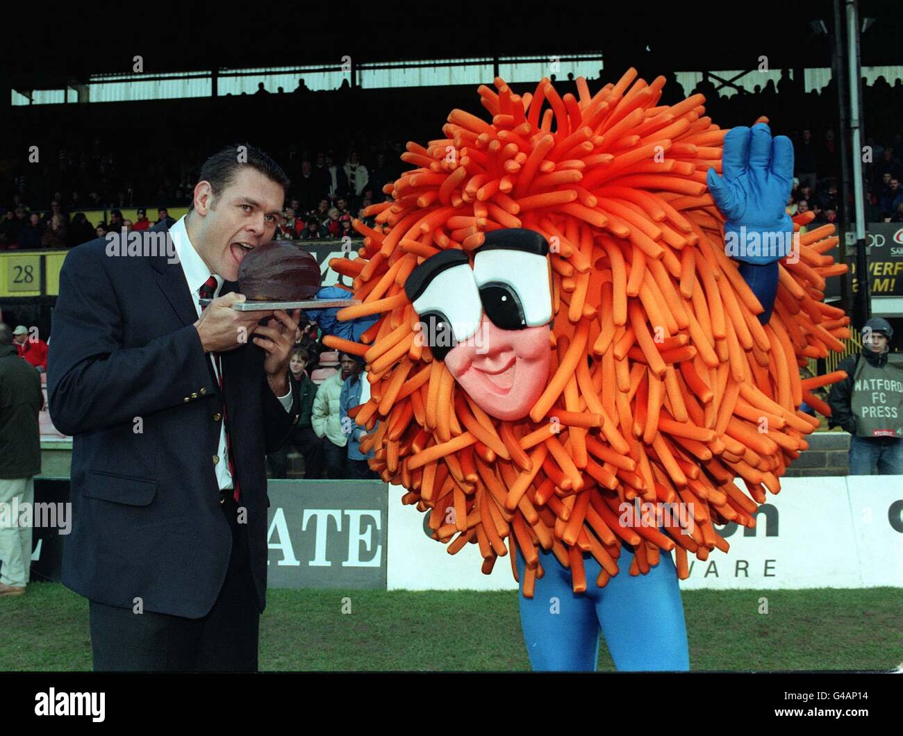 Saracens Tony Copsey is presented with a good luck trophy - a ...