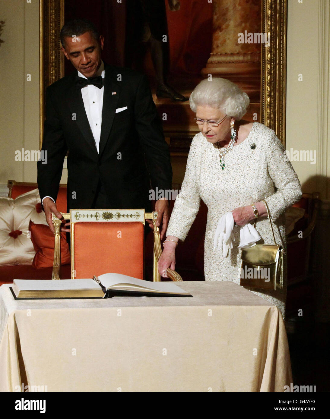 Queen Elizabeth II arrives to sign the guest book as she bids farewell to US President Barack Obama and First Lady Michelle Obama, watch by the Duke of Edinburgh at Winfield House - the residence of the Ambassador of the United States of America - in Regent's Park, London. Stock Photo